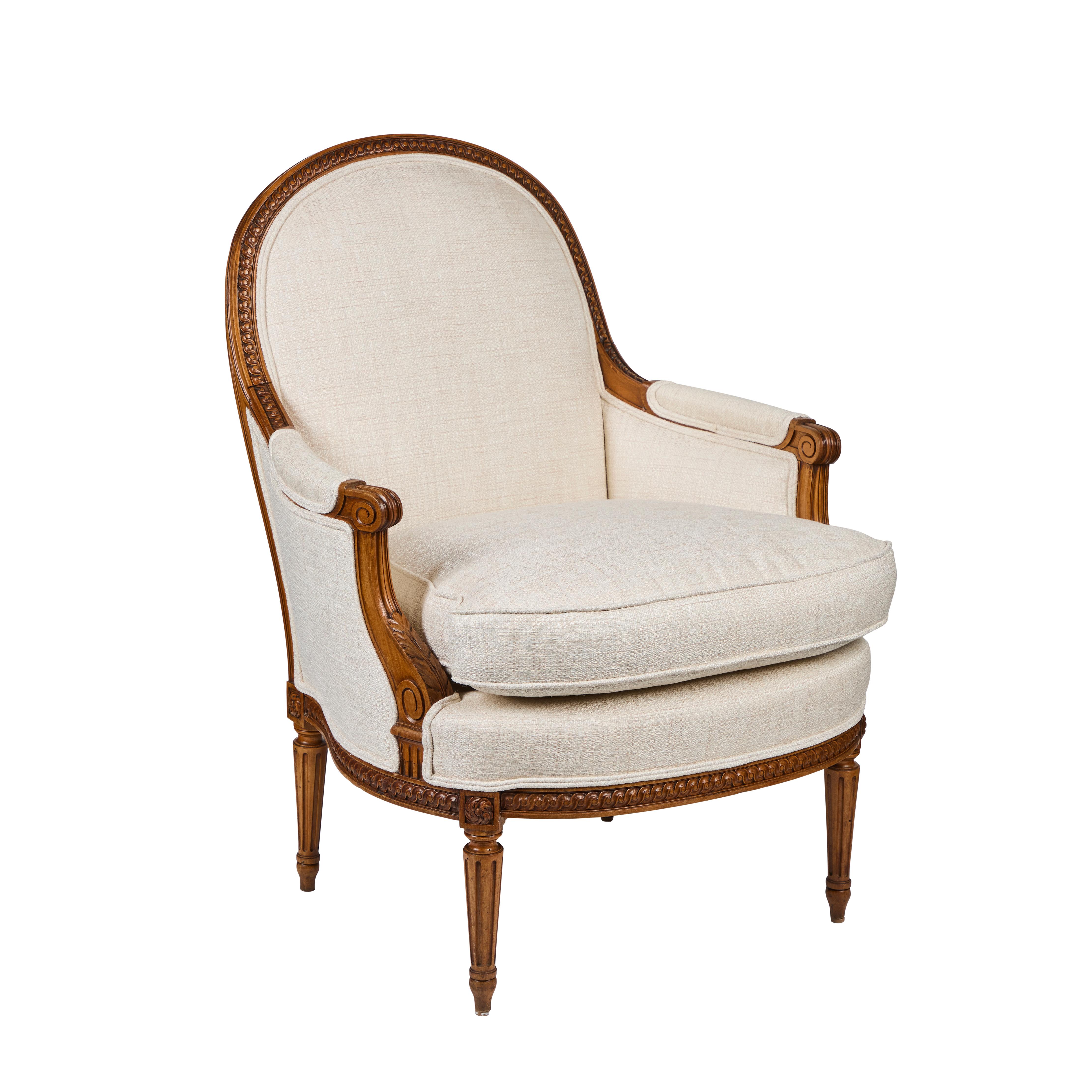 
Pair of hand-carved, walnut bergere chairs.  Newly upholstered in woven fabric by Pendler.
