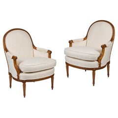 Pair of French Hand-Carved Walnut Bergere Chairs