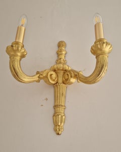 Pair of Hand Carved Water Gilded 2 arm sconces in the Hollywood Regency style