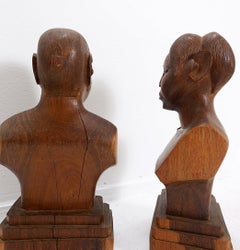 Pair of hand-carved wooden woman/man bust statues - 20th