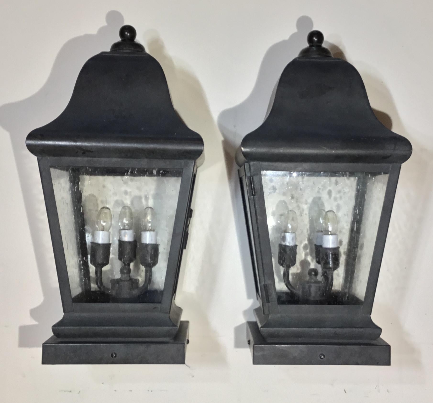 Pair of decorative post lantern handcrafted from solid brass, seeded glass ,with three 40/watt lights each ,suitable for wet locations ,up to US code ,UL approved. Very easy installation.
Base size: 7”x7”.