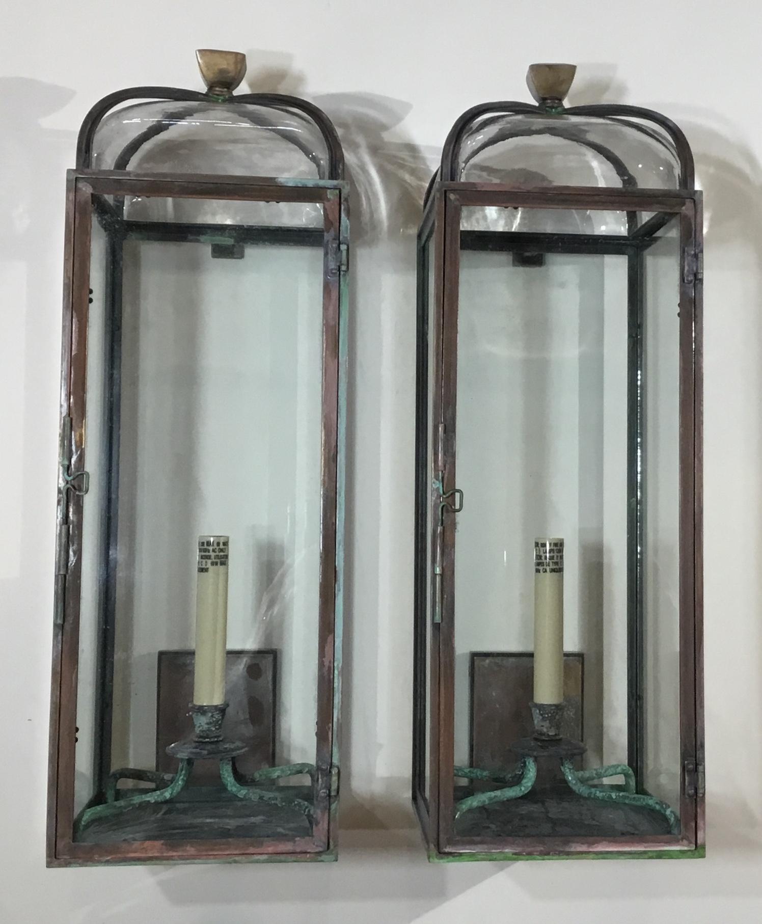 Elagent pair of wall hanging lantern, handcrafted from solid brass and bronze combine, to make this beautiful wall hanging lantern or sconses, exceptional glass dome with very attractive top finial.
Electrified with one 60/watt light, suitable for