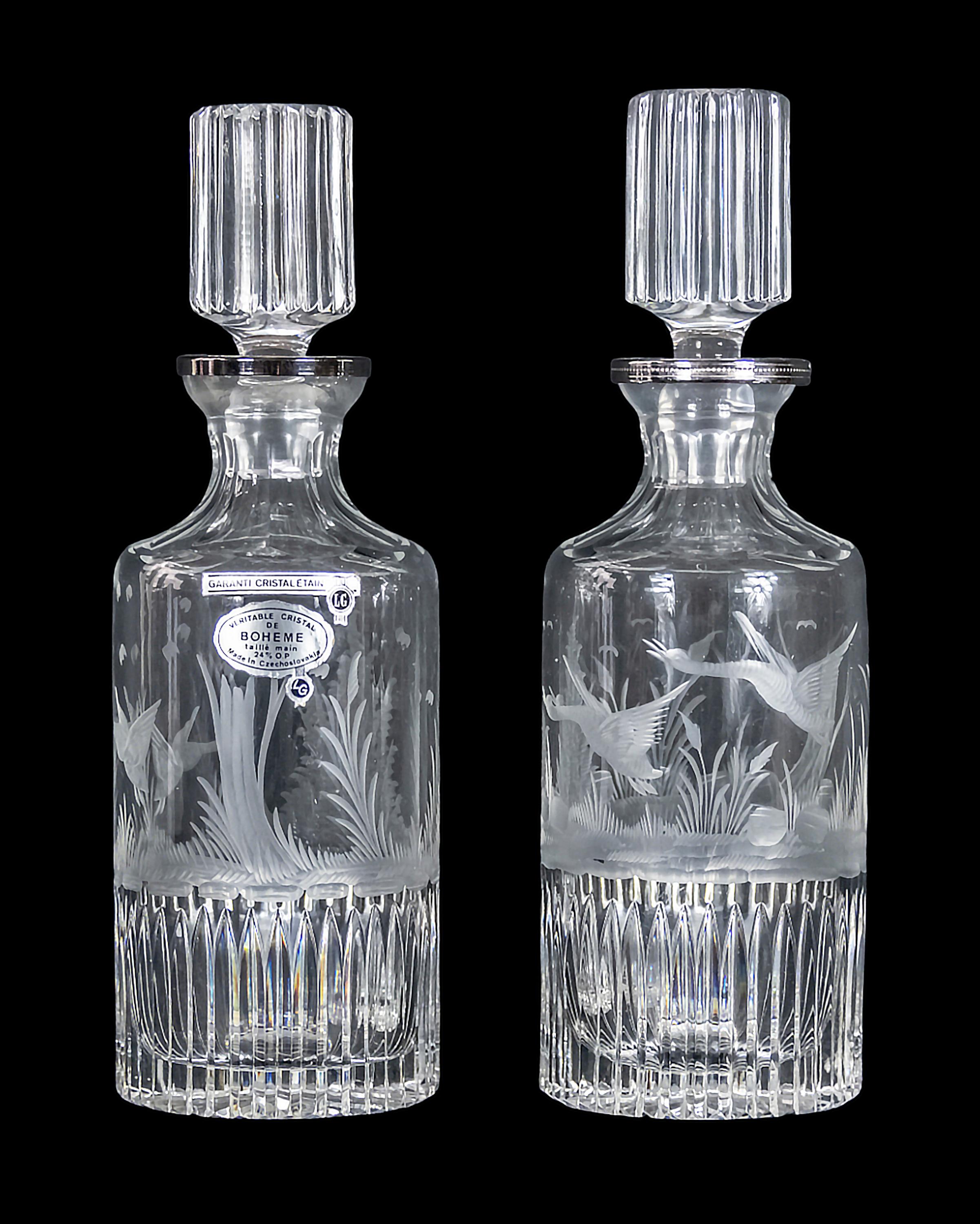 Pair of  hand etched and cut crystal decanters mounted with silver plated necks. 
Labeled.
