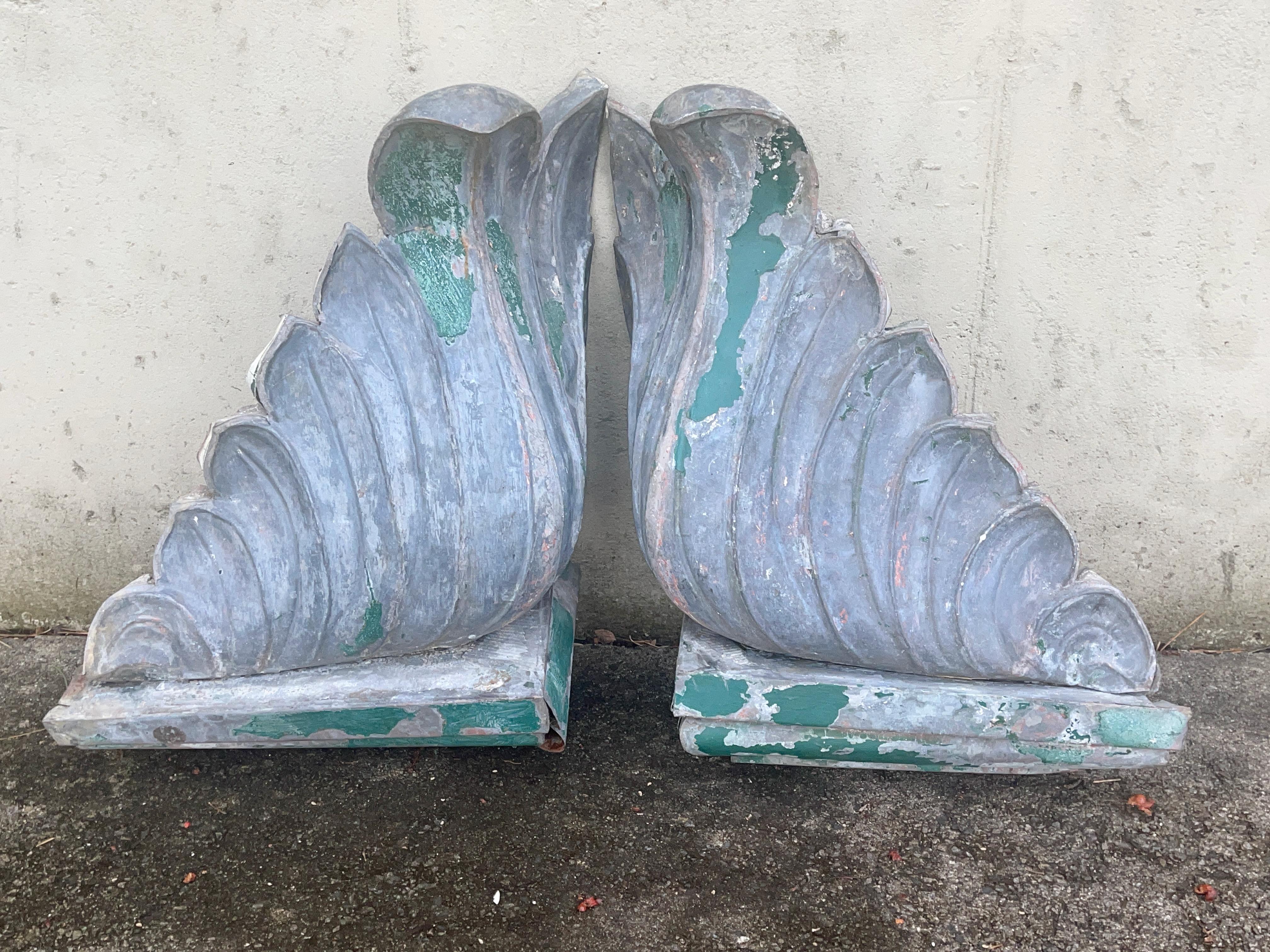 Pair of hand cut and formed sheet metal corner architectural finals possible for a ridgecrest. 
Looks and feels like copper although I believe it is something else, like zinc or magnesium. 
It is neither brass, steel nor aluminum.
Incredibly