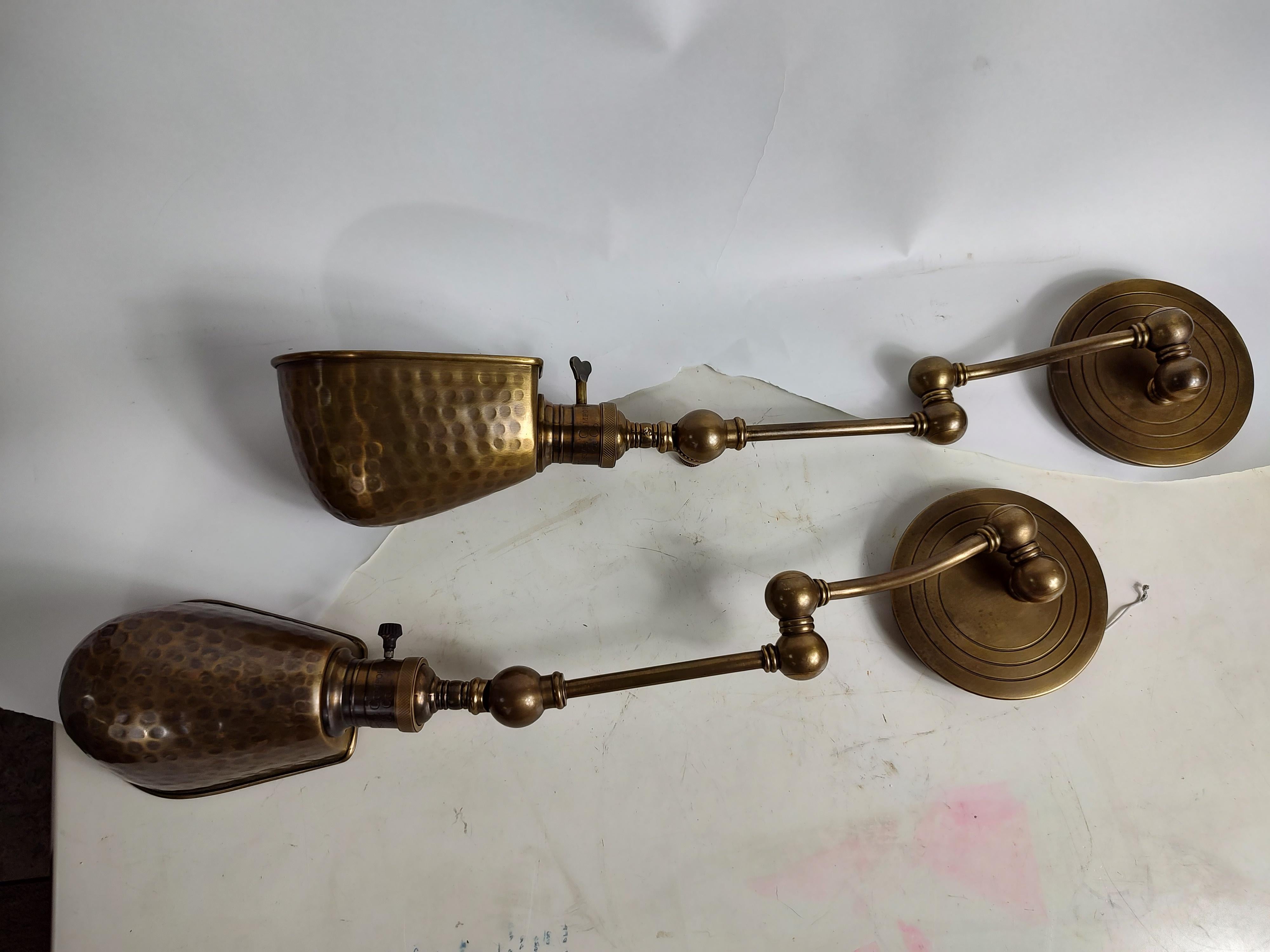 Great pair of virtually new hand hammered Brass wall lights by Visual Comfort. In excellent condition with no wear. Unused new old stock.