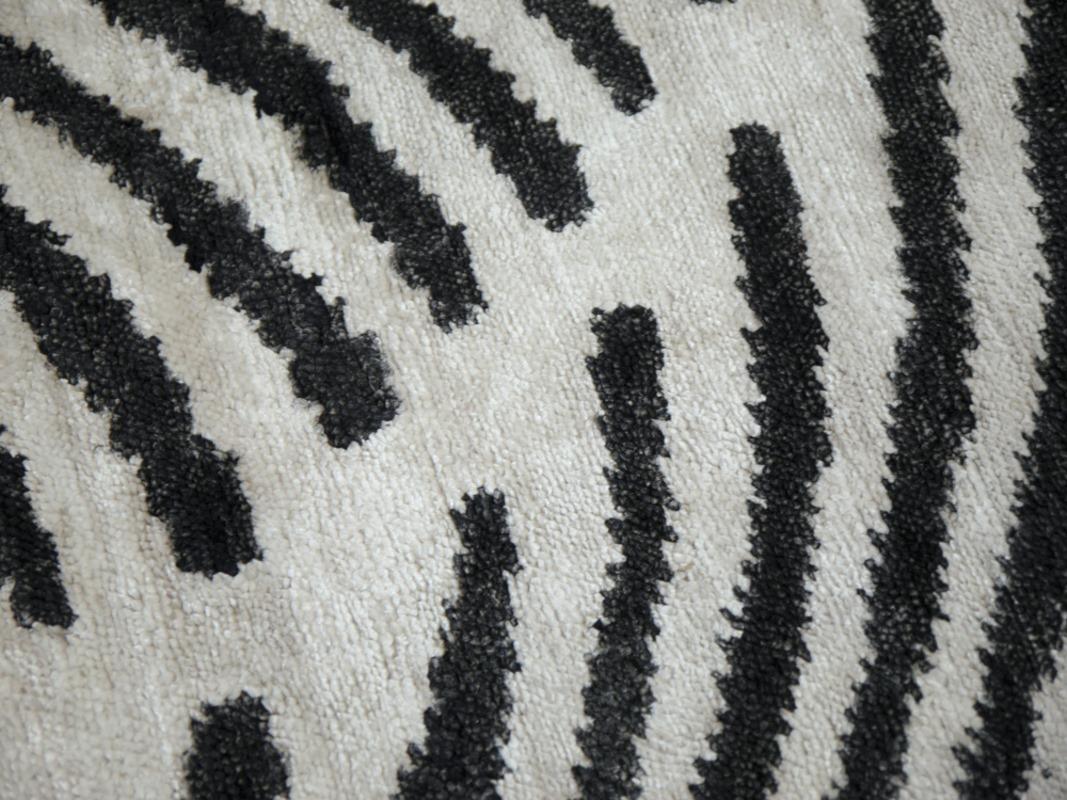 A pair of Zebra design rugs, contemporary production, in style of Art Deco, hand knotted, using finest hand spun Bamboo Silk.

This pair of hand knotted Zebra Hide Design Rugs has the Art Deco touch. Animal print designs were on Vouge in the 1920´s