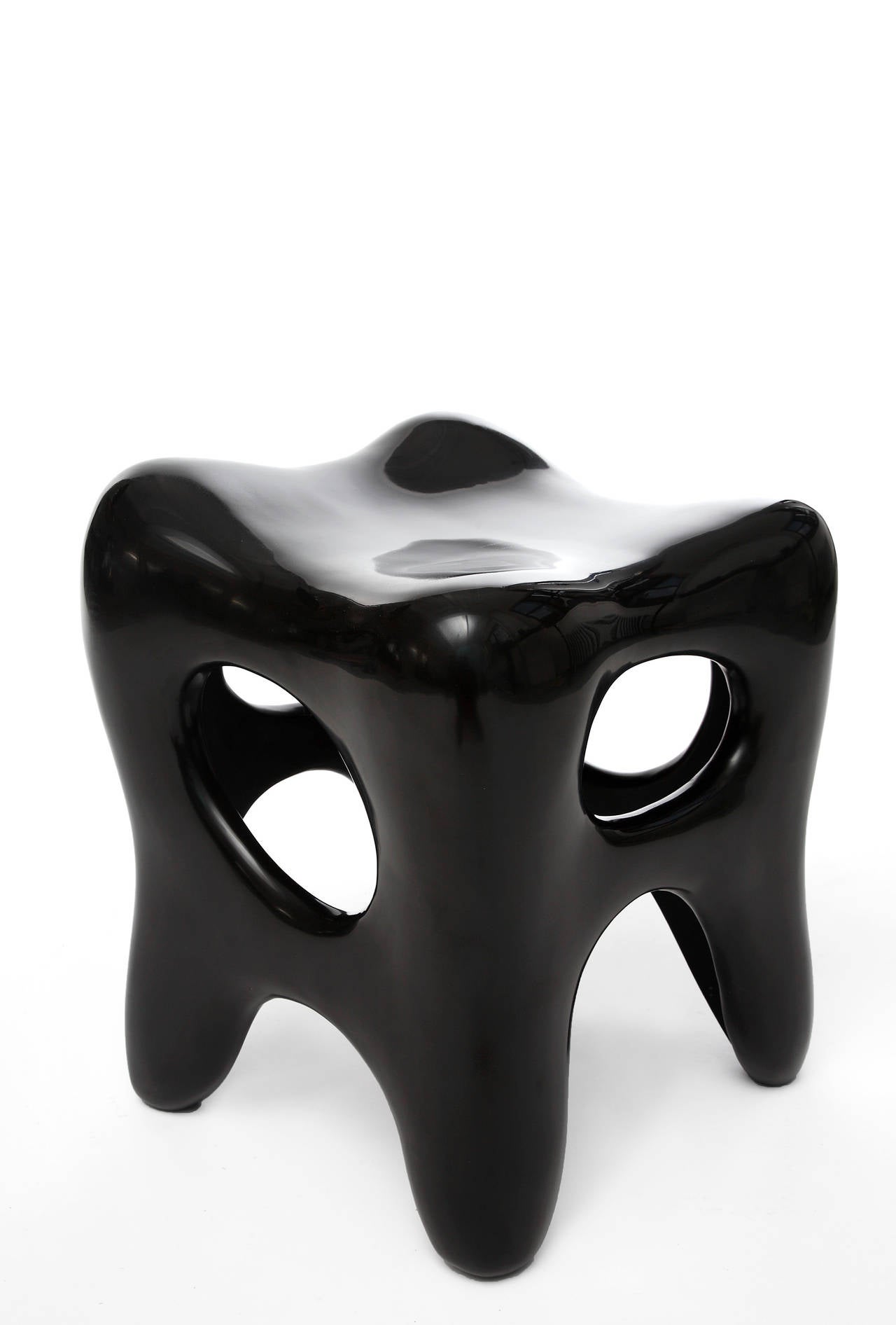 Sculpted stools made of recycled wood and finished with black lacquer.
Jacques Jarrige's iconic stool plays with positive and negative space. Each one is sculpted by hand and unique. The movement imbued creates everlasting life in the object always