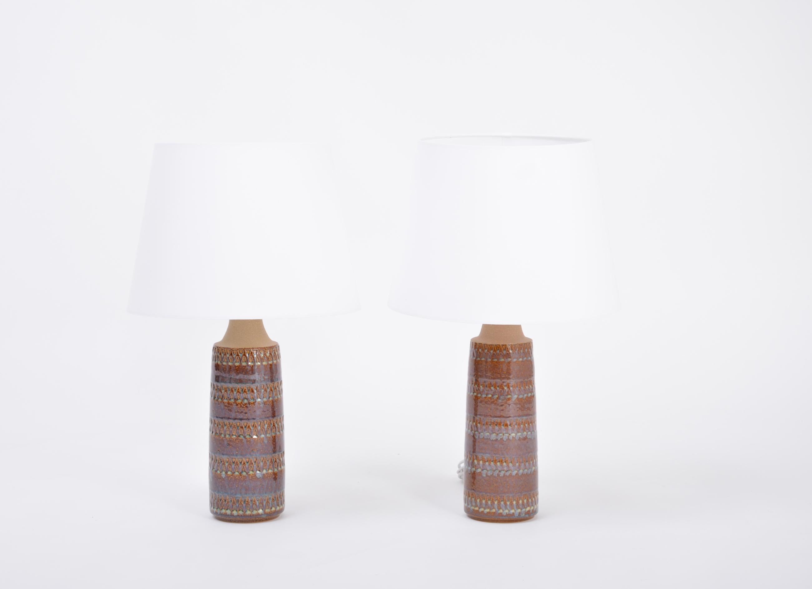 Pair of hand made Danish mid-century ceramic table lamps by Soholm Stentoj

Handmade and hand decorated Danish modern stoneware table lamps manufactured by Søholm Stentøj on the Danish island of Bornholm in the 1960s. Light blue glaze flows down