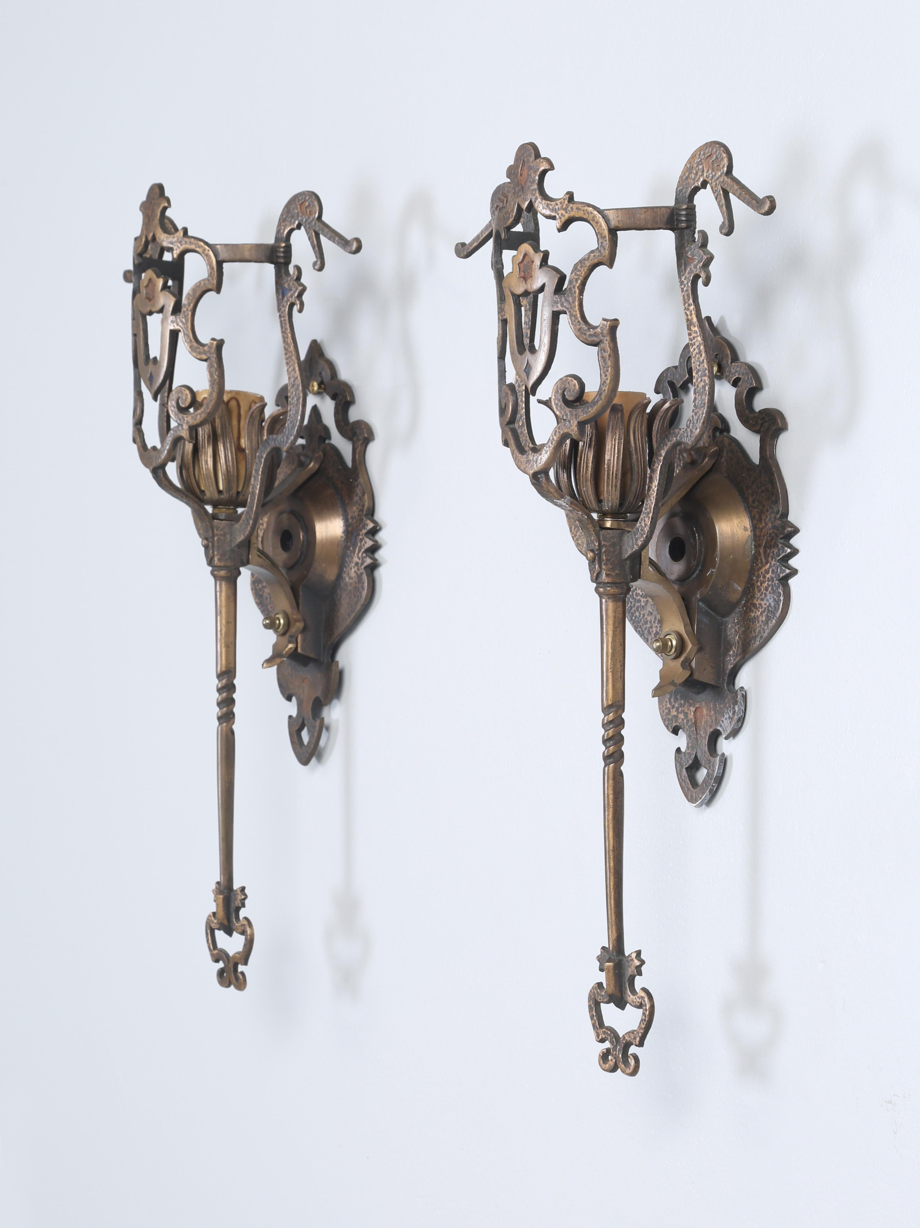 Pair of hand-made very unusual solid brass sconces that were removed from The John Rogerson Montgomery House, a residence designed by famous local architect Howard Van Doren Shaw. It is considered to be a significant example of Georgian Revival