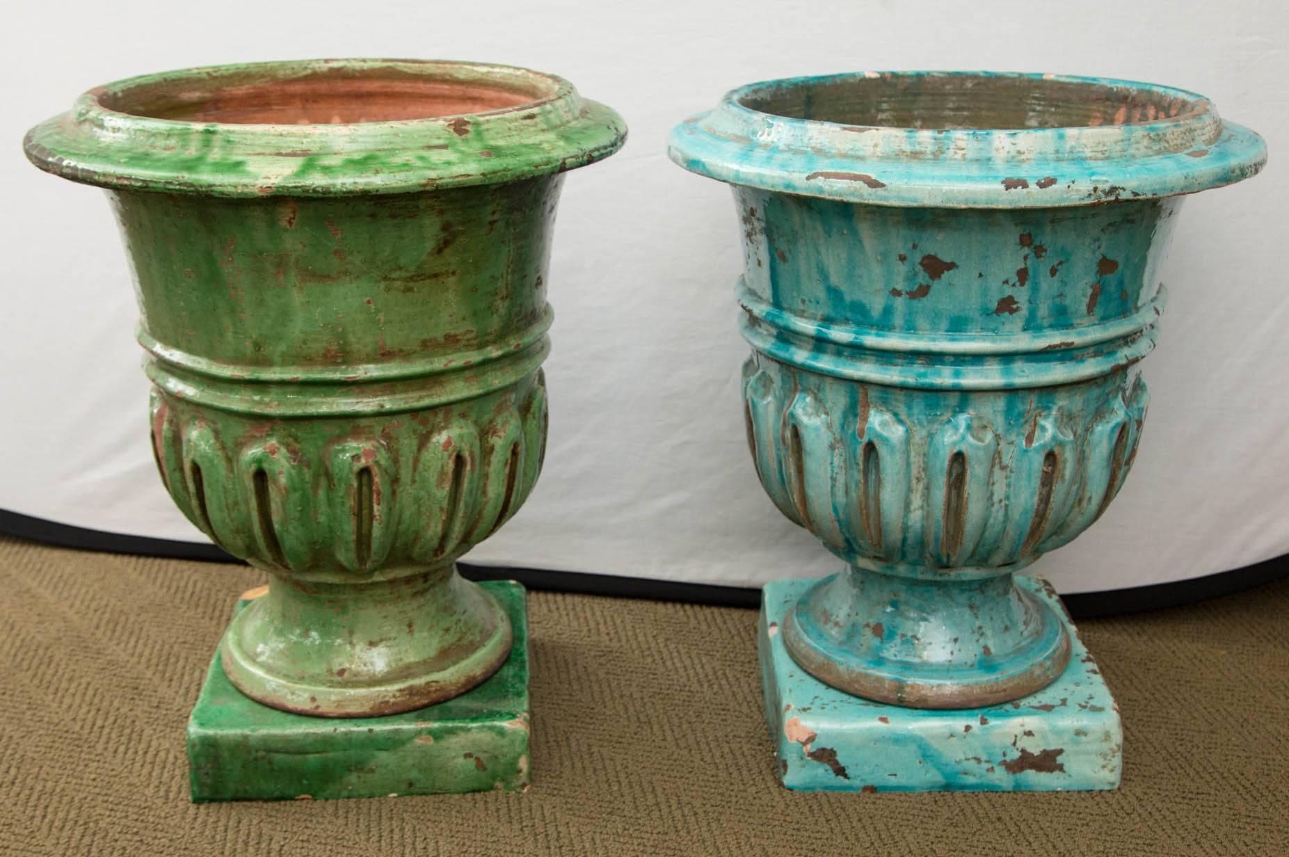 Pair of hand-painted blue and green terracotta planters.