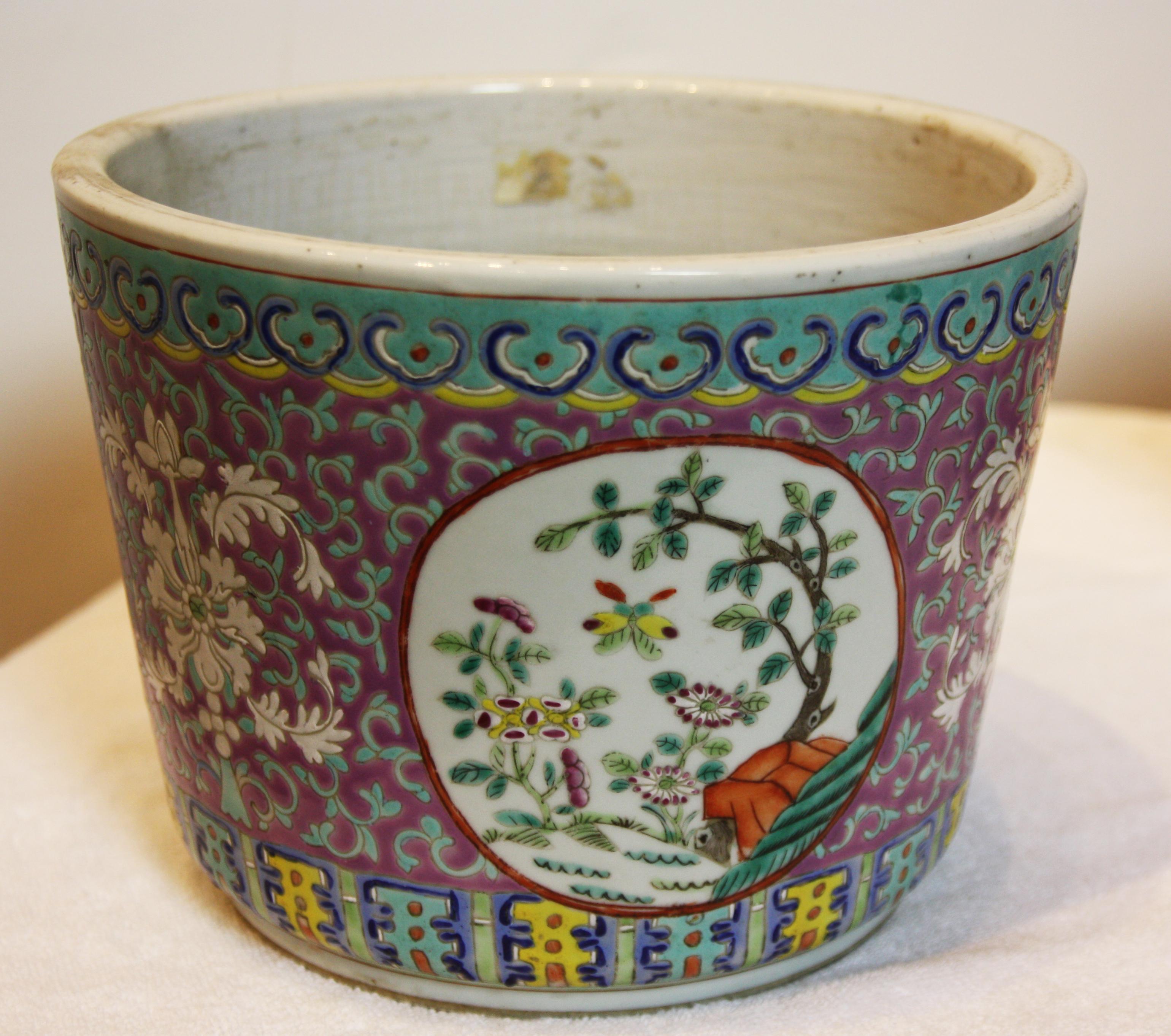 Lovely pair of hand-painted cachepot jardinieres with intricate design work and nature scenery.