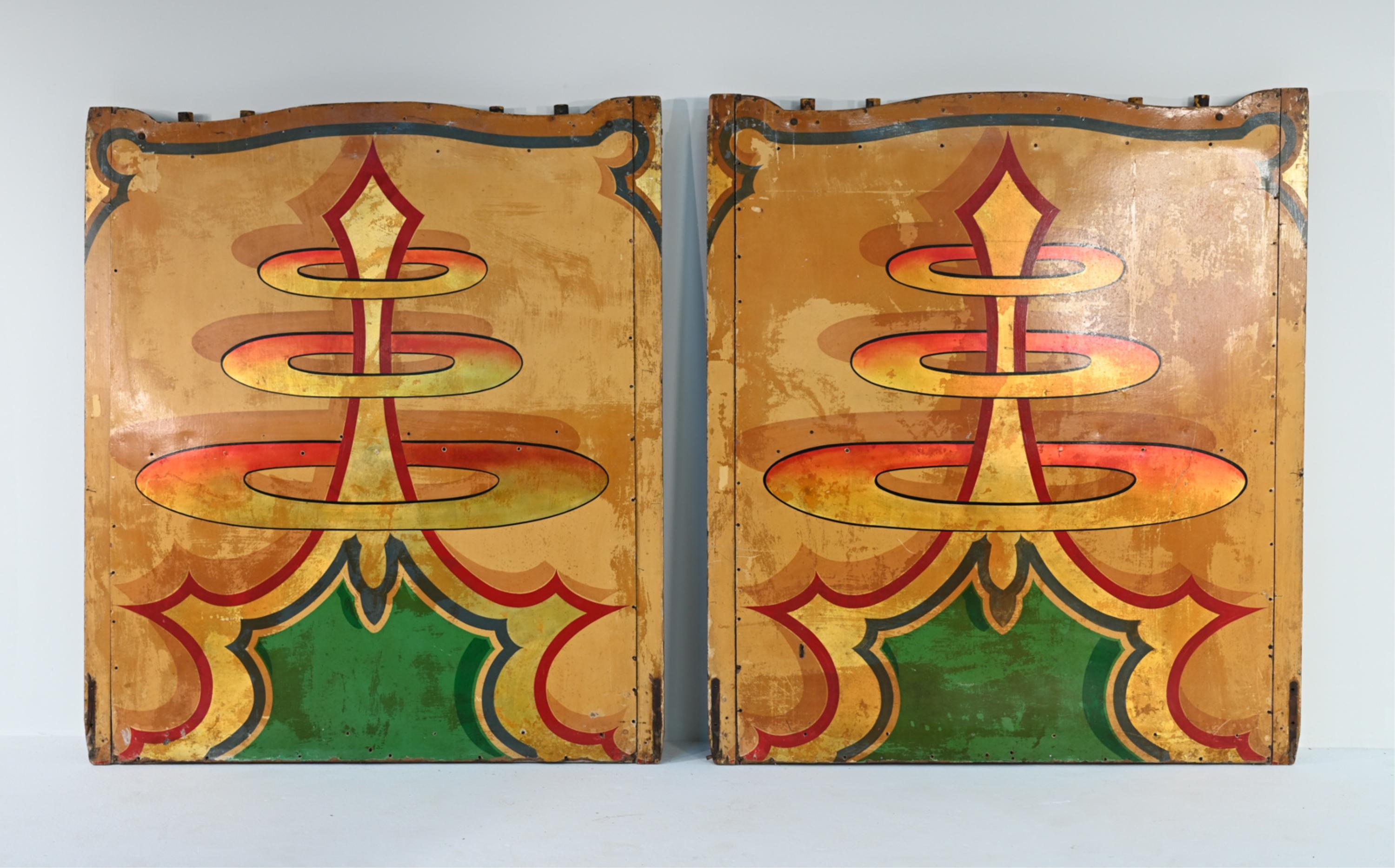 Bring an unusual piece of folk history into your home with this stunning pair of early 20th century rounding boards salvaged from a carnival. With hand painted designs and gold leaf pigment, these boards are a whimsical, decorative architectural