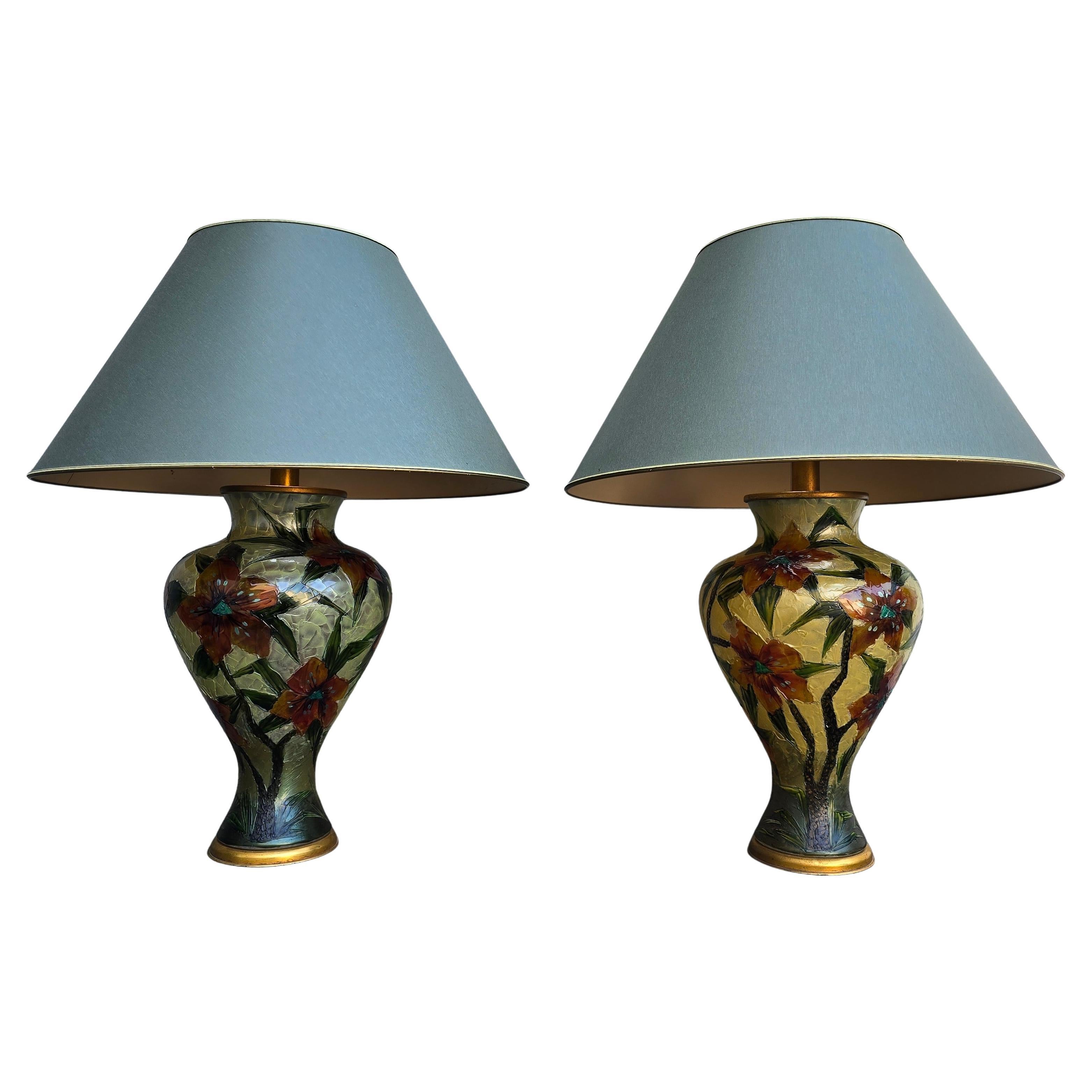 Pair of Hand-Painted Floral Glass Table Lamps – Italy, circa 1980

Striking and artistic pair of glass table lamps, hand-painted with vibrant floral motifs in rich tones of orange, deep red, green, and teal. The flowers are beautifully rendered with