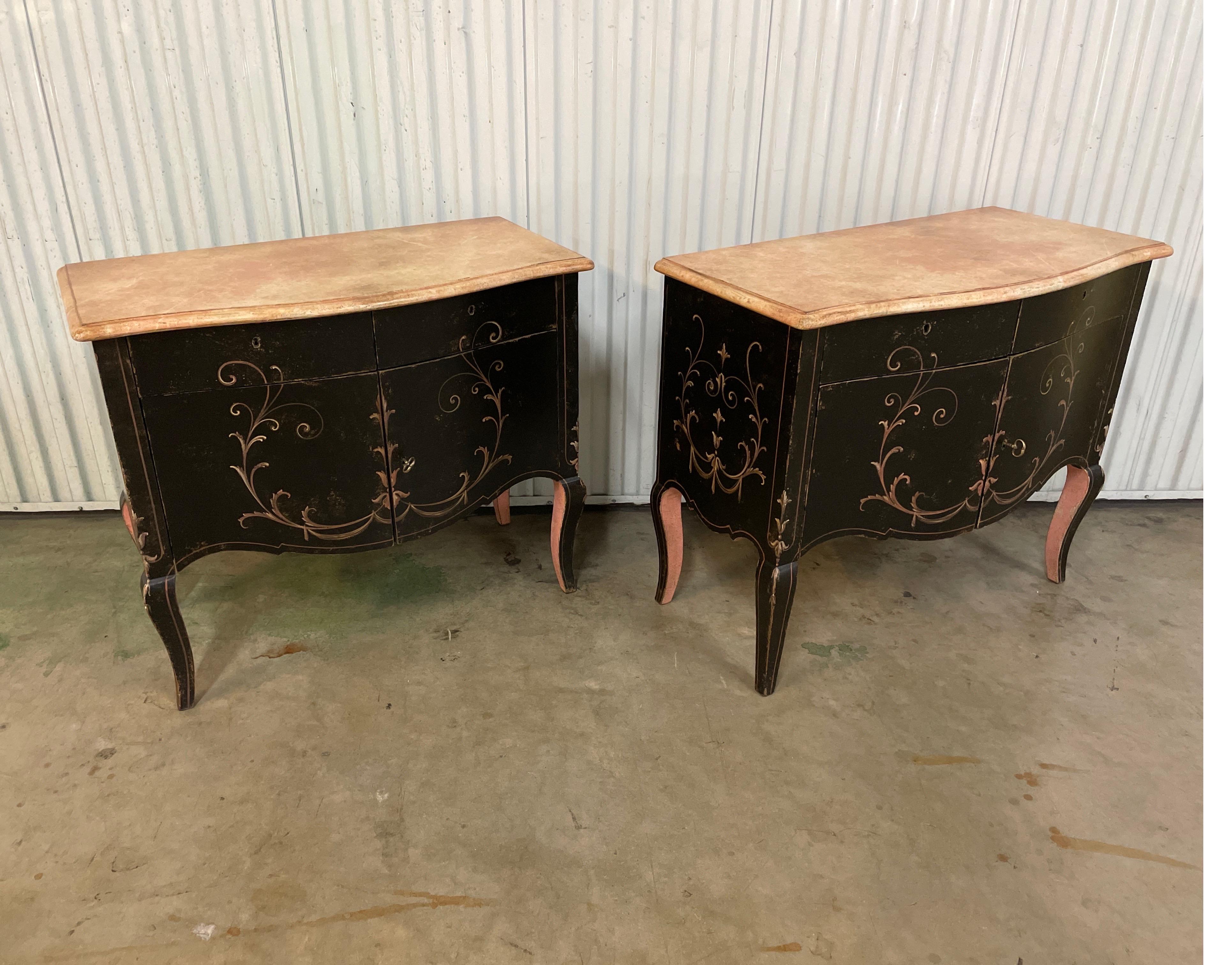 Pair of hand painted cabinets with two drawers over two doors. Venetian style faux painted marble tops.
Would make great nightstands.