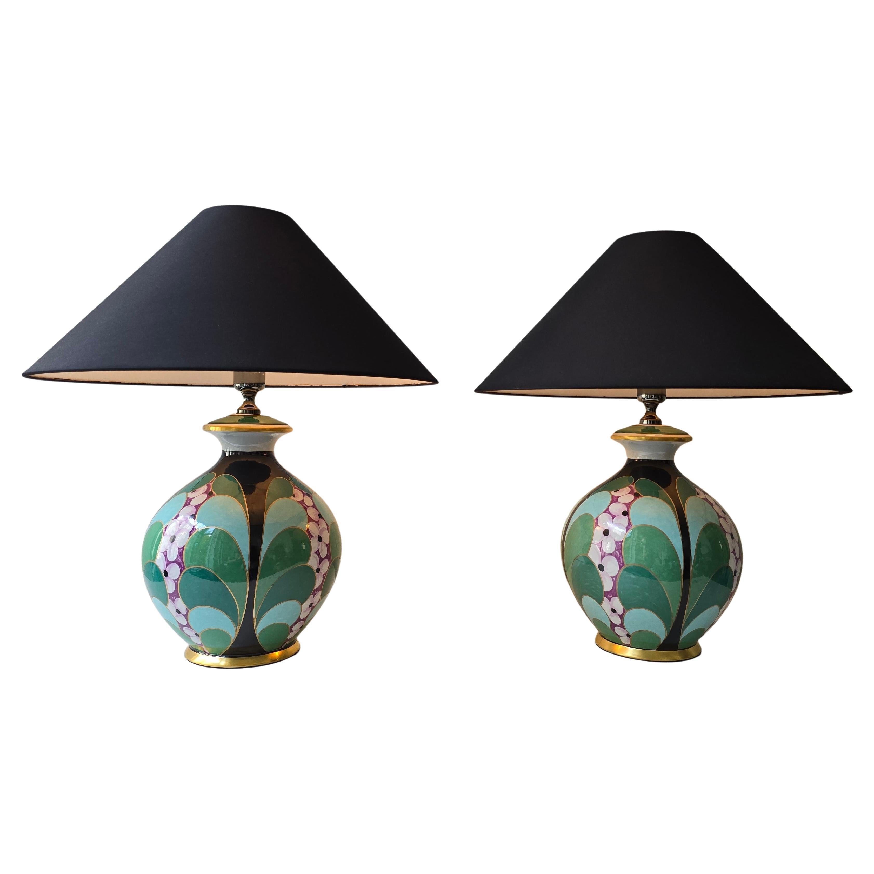Elegant pair of Italian table lamps, entirely made of hand-painted porcelain by Manifattura Artistica Le Porcellane, Florence, Italy, circa 1980s. These lamps capture the refined spirit of postmodern Italian design, featuring bold Art Deco–inspired