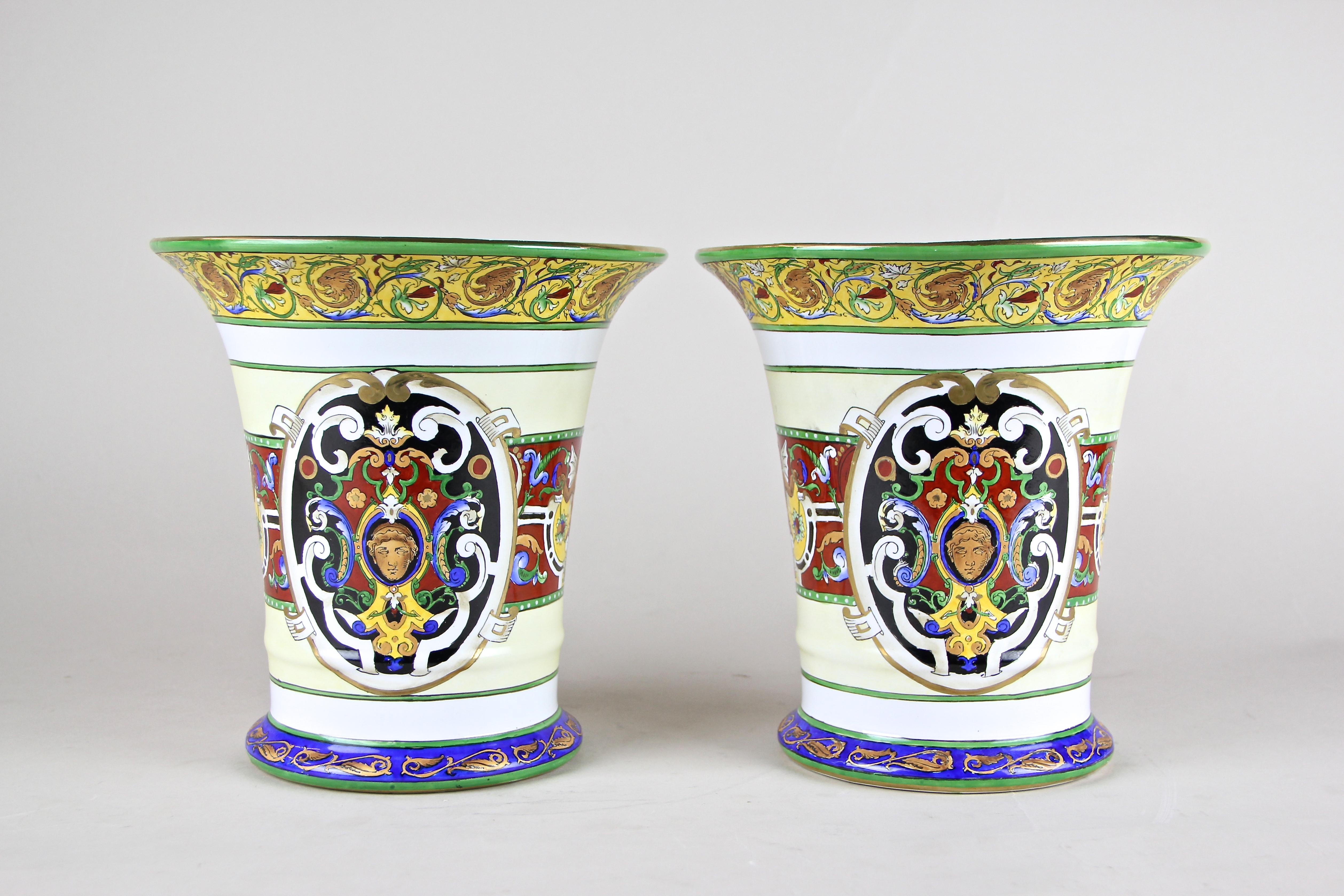 Decorative pair of hand painted porcelain vases out of Italy from the beginning of the 20th century. A great shaped body and the wonderful hand painted design makes this pair of Art Nouveau vases a very decorative one. The unique coloration reminds