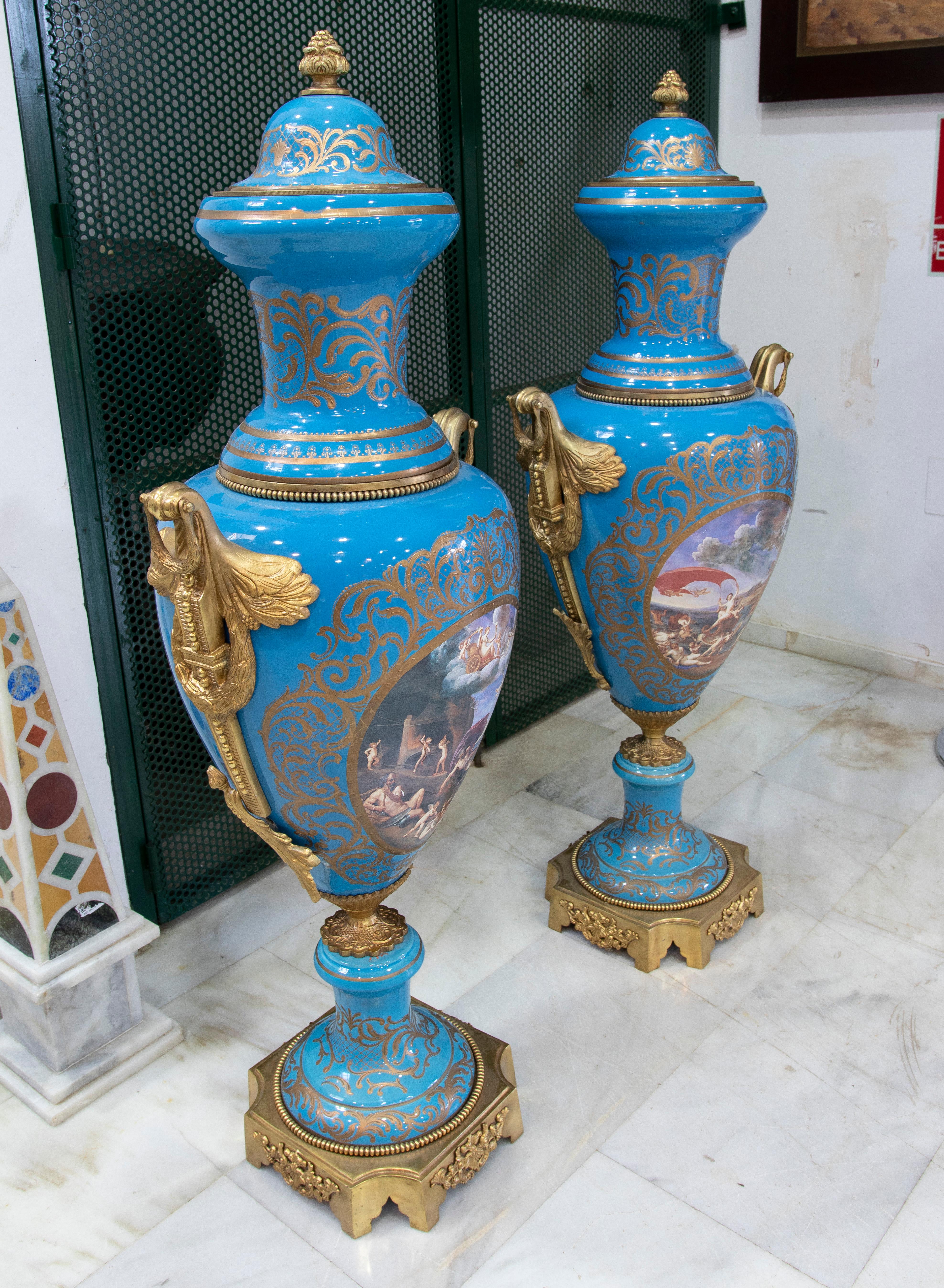 Pair of Hand-Painted Porcelain vases with bronze handles.