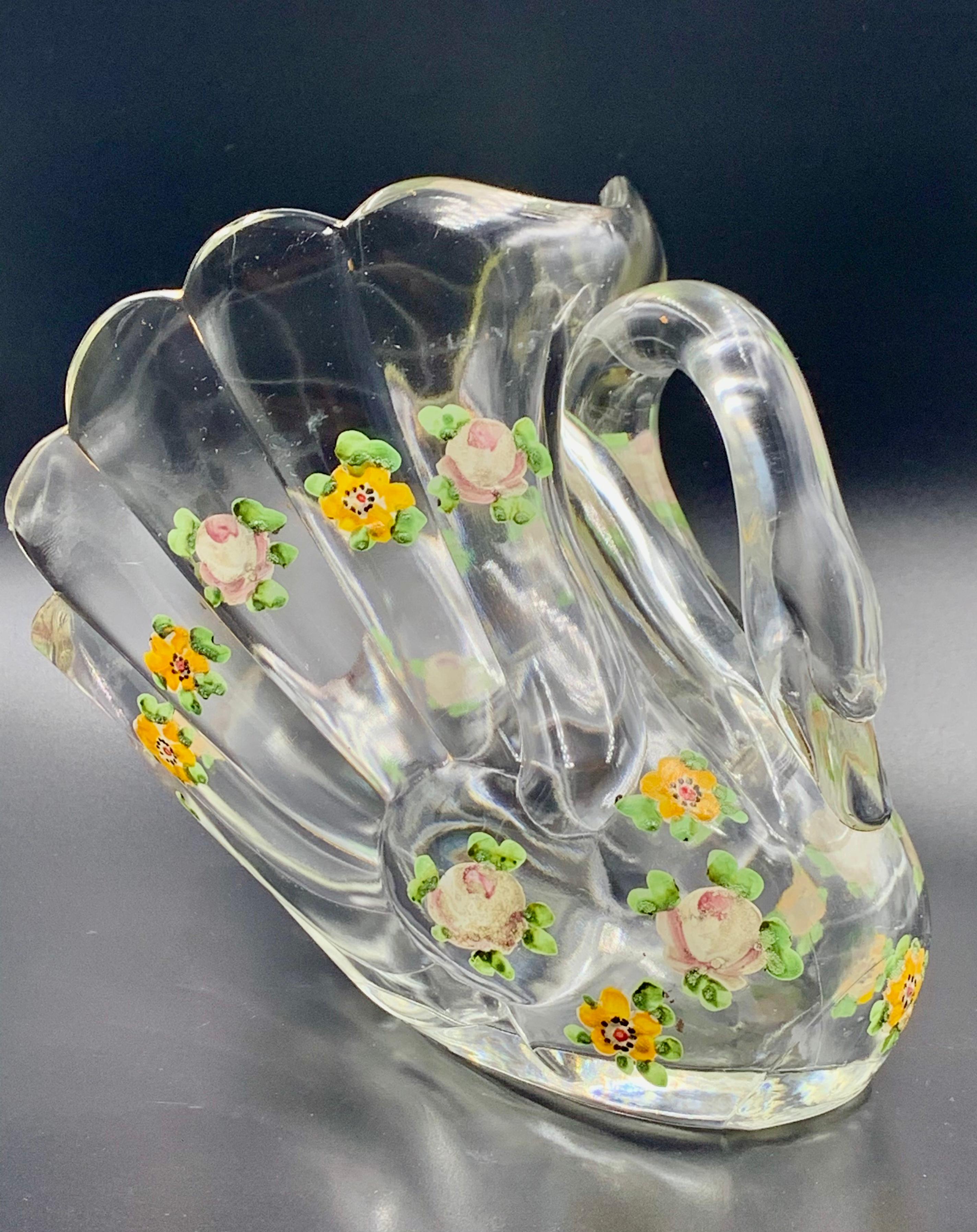 Beautiful pair of figural swan glass pieces decorated with hand painted flowers. Perfect as a serving piece on you table or as a flower holder.

Length is 6.5