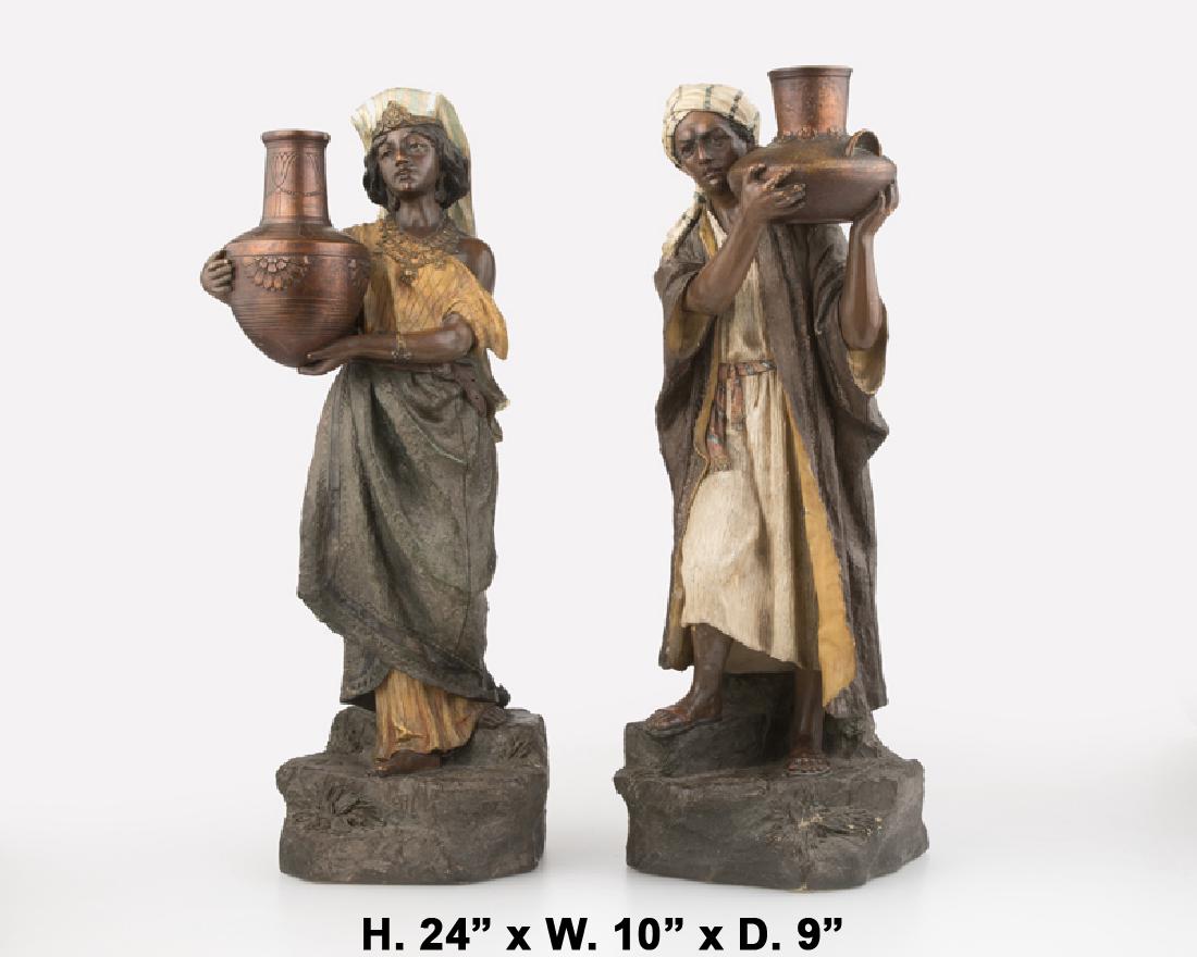 Lovely Pair of cold-painted terracotta figures oh a man and a woman holding jugs.
meticulous attention has been giving to every details.

