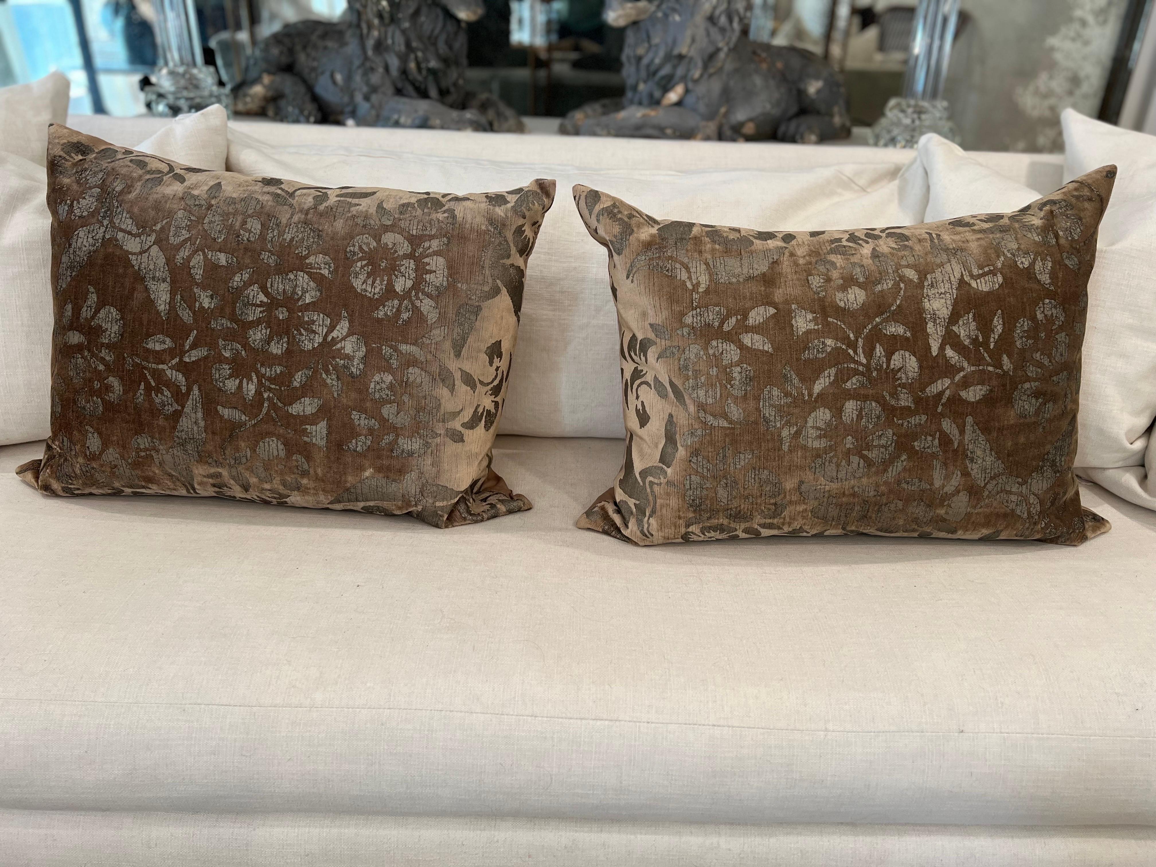 Pair of hand-painted velvet pillows with silk backs.  Tan silver/gold sheen.
These were imported in the early 2000's and have had light use.  There are some spots on the silk as seen in the pics.  Zipper closure.
Includes feather inserts.  