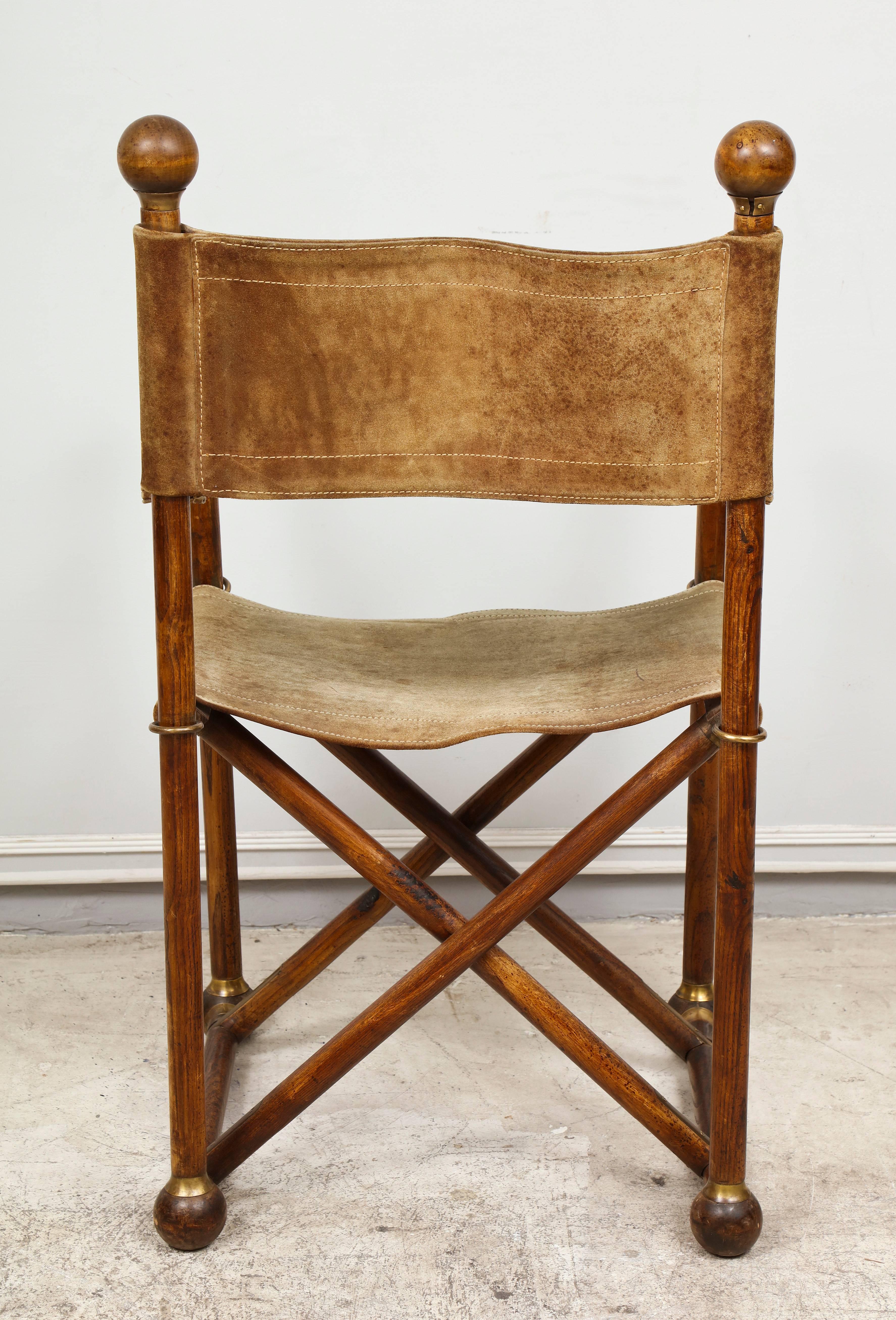 An exceptional pair of hand-stitched Suede Director's chairs with brass hardware on stretcher base, very comfortable and great quality.