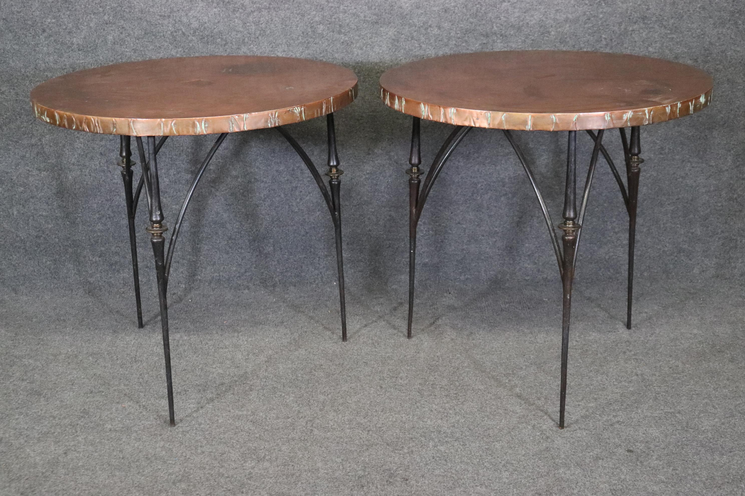 This is a fantastic set of hand-made copper wrapped wooden topped brass and wrought iron Directoire style tripodial end tables or gueridons. The tables are in distressed used condition but of course can be painted, polished or refinished and