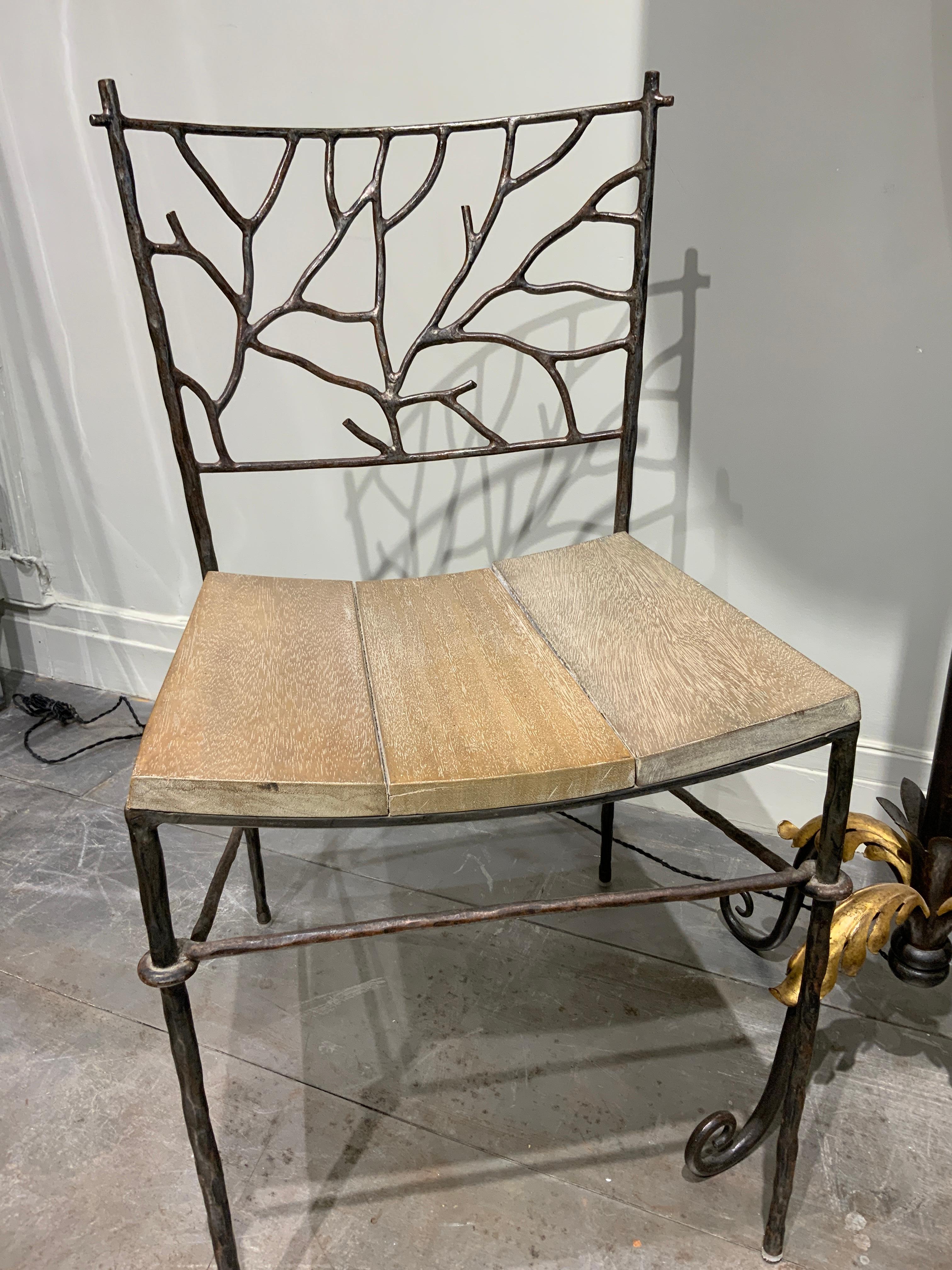 Exquisite and unique pair of hand wrought iron naturalistic chairs France circa 1960
Oak seat 
