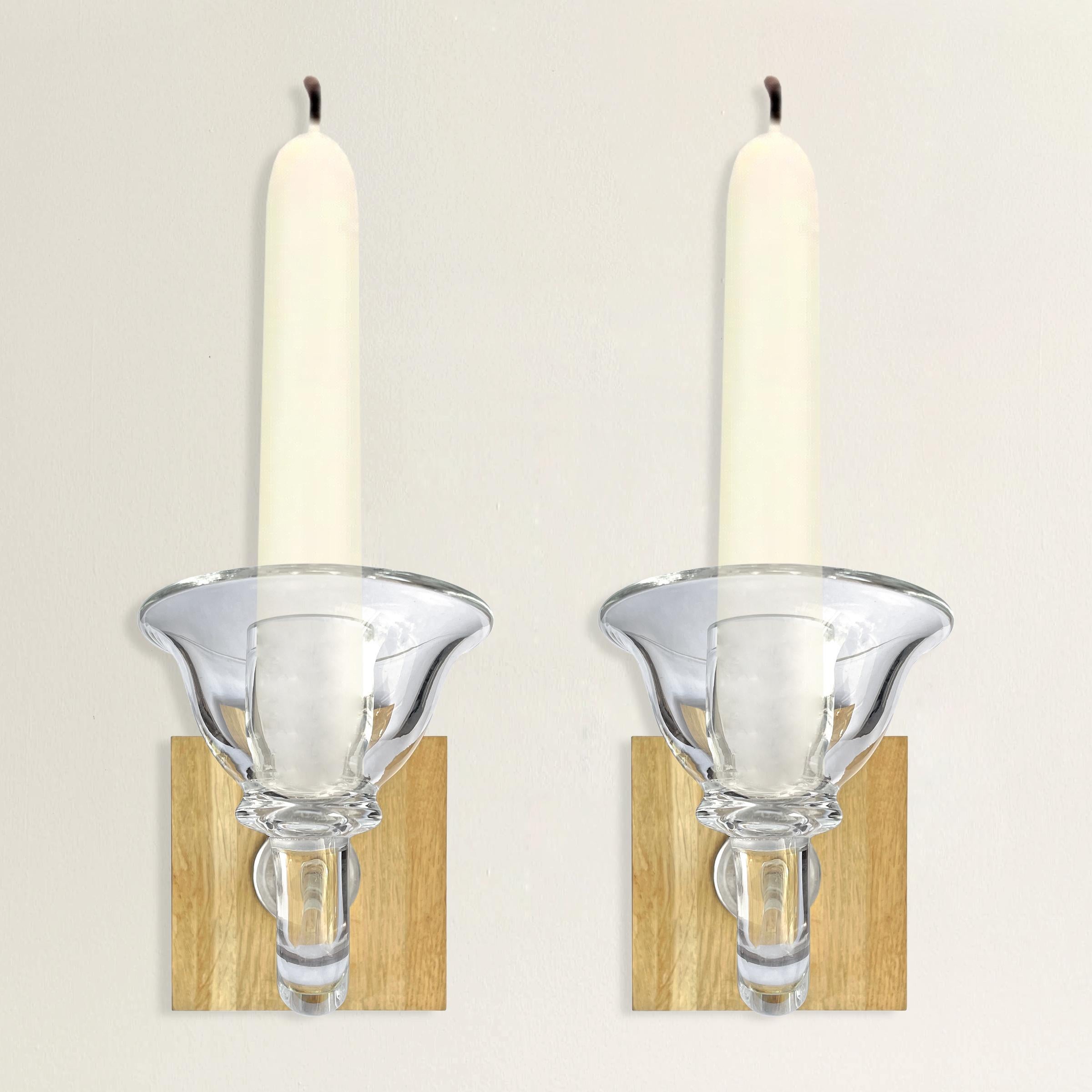 A chic pair of Belgian handblown glass candle sconces with wide bobeches, curved arms, and mounted to a modern oak wall mounts. Etched 'Cleybergh' on each arm. Intended for use with tapers.