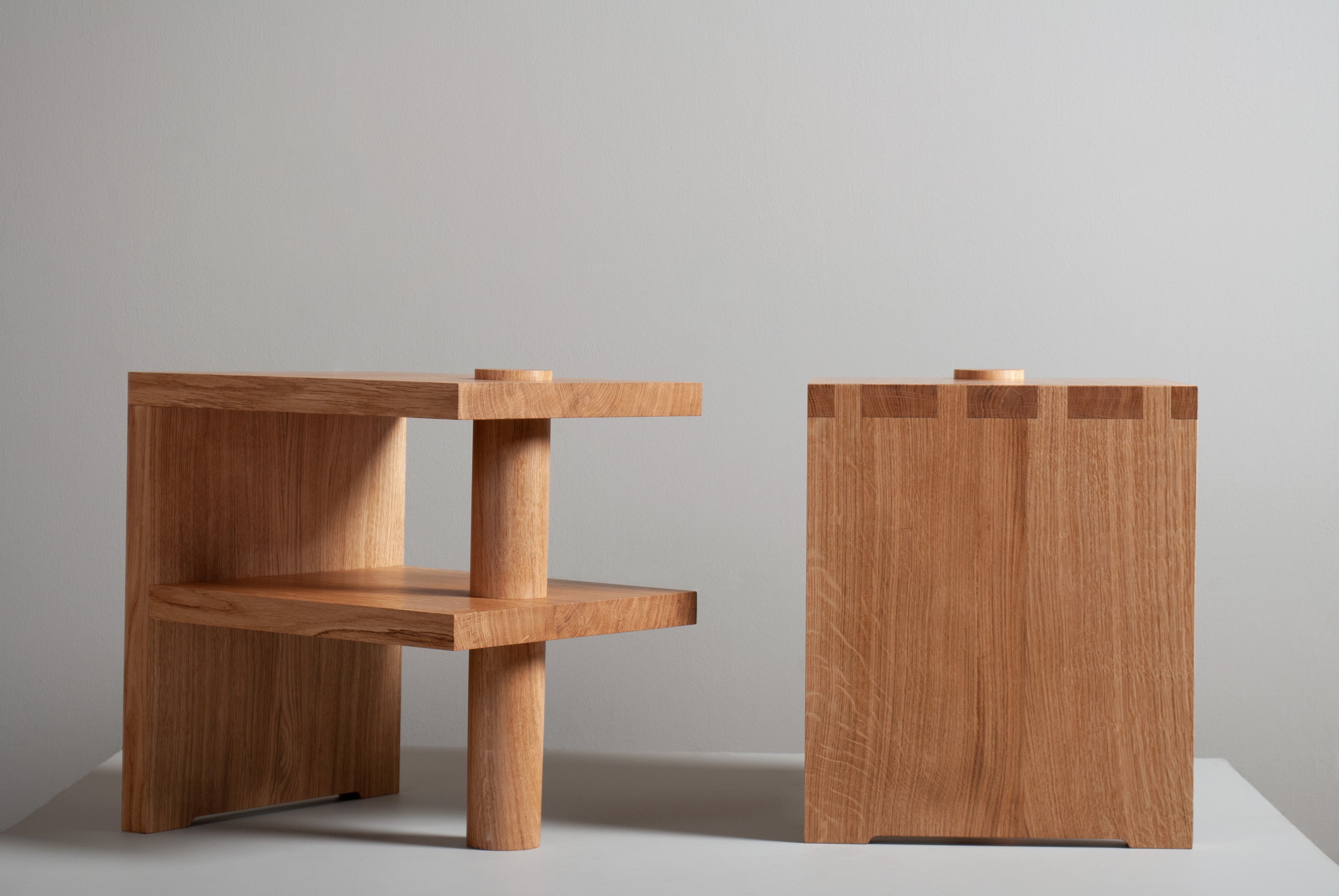 Architectural oak Pillar nightstands or end tables. Early European modernism inspired - with a hint of Japanese minimalism - always focusing on the beauty of the materials. 
Designed by SUM furniture and handcrafted in England using traditional