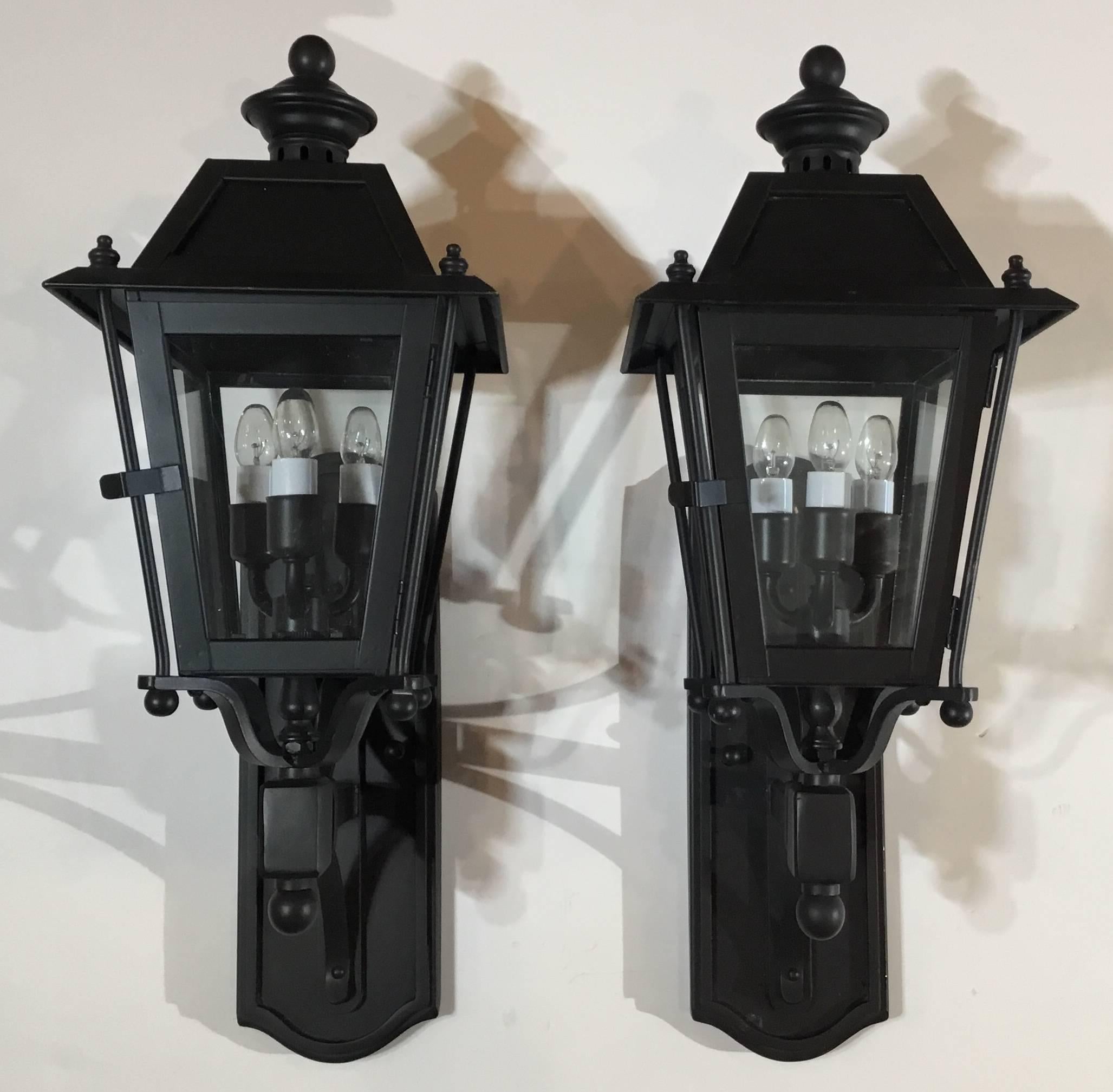 Pair of decorative English style lanterns, handcrafted from solid brass , electrified with 3 40/watt light each ,UL approved ,up to US code , suitable for wet locations. Very impressive pair for the front of the house.