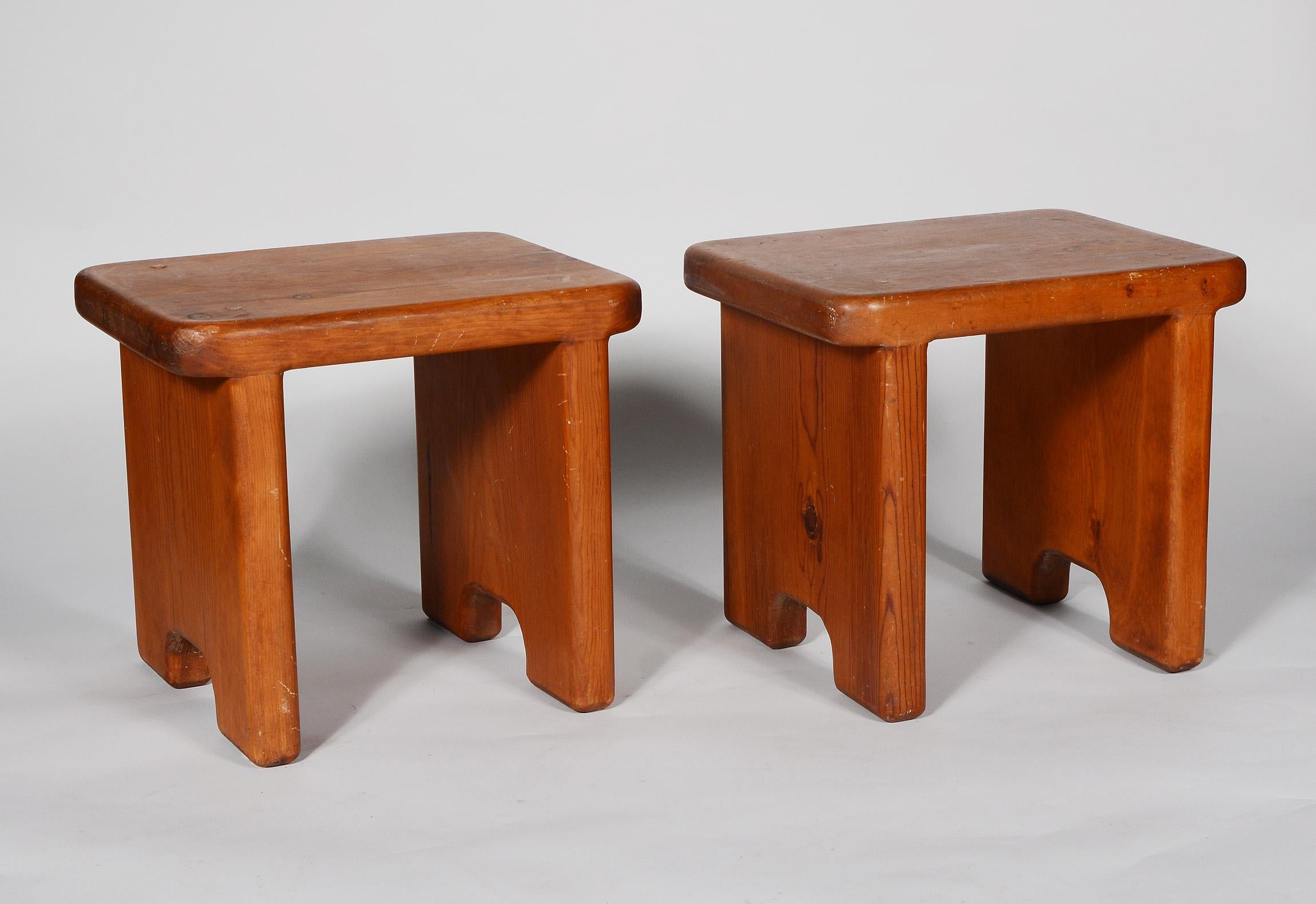 Pair of craft studio stools or small tables. These stools have the classic California modern design with Asian influence. These appear to be executed in redwood. The stools have been cleaned and waxed and exhibit a great patina from years of use.