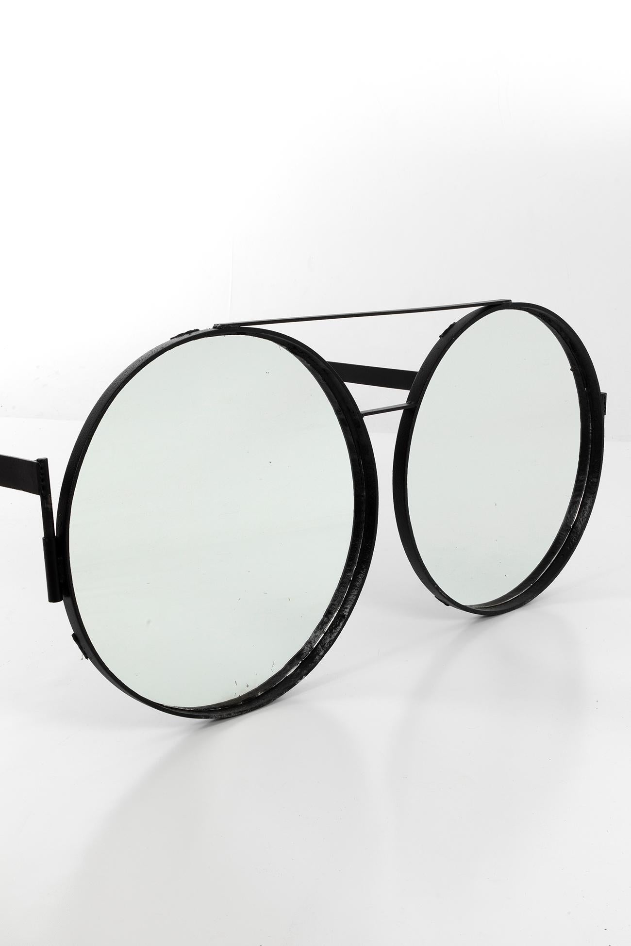 A very unique pair of oversized, handcrafted glasses. Made of iron with mirrored lenses, perfect for use as a film prop or shop display. 

Additional information:
H 66 cm (H 25.1 inches)
W 63 cm (L 95.2 inches).