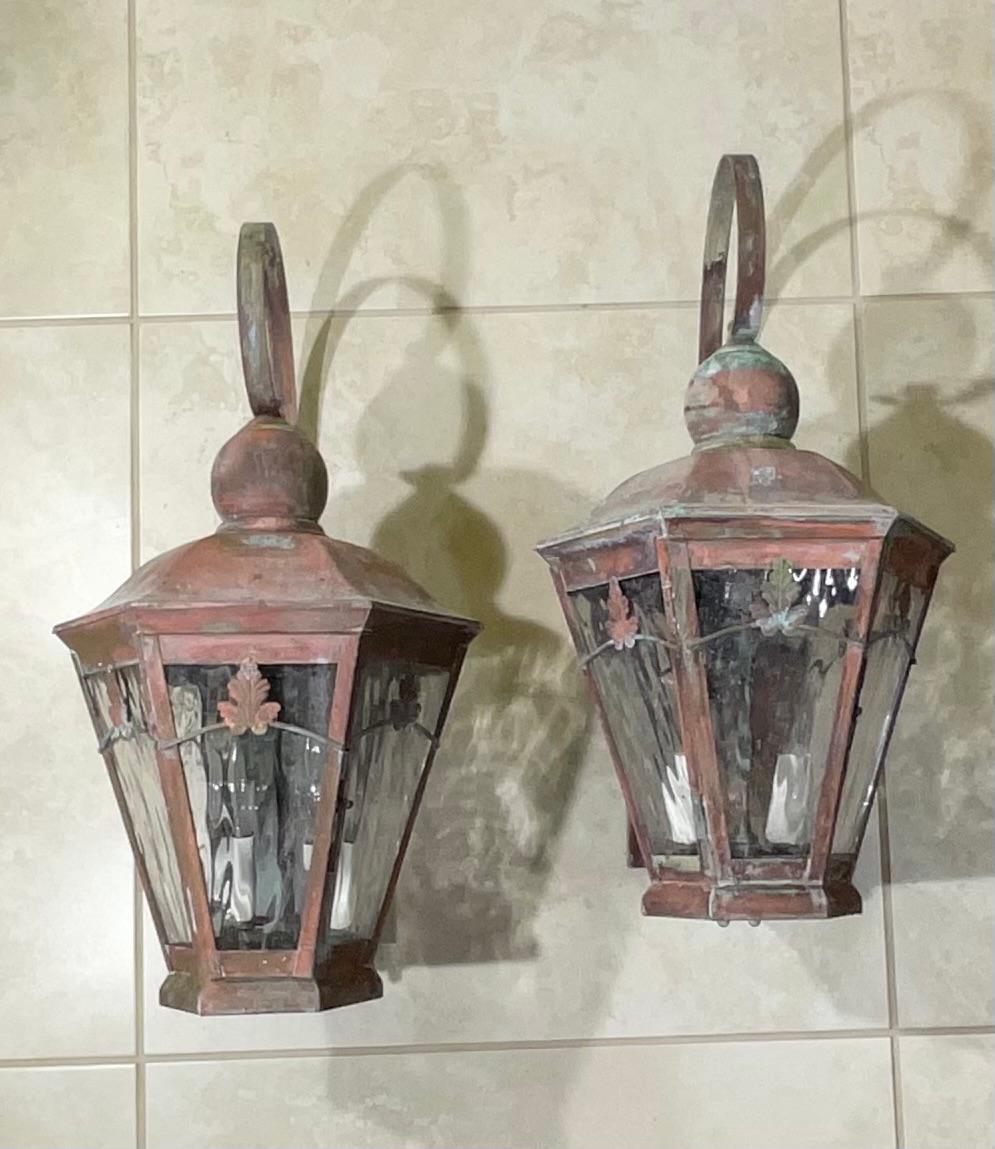 Beautiful pair of vintage wall lanterns Artistically hand crafted made from solid brass with two 60/watt lights each .
Nicely oxidized . patina , textured glass , electrified, and ready to use.
Will look great indoor or outdoor.