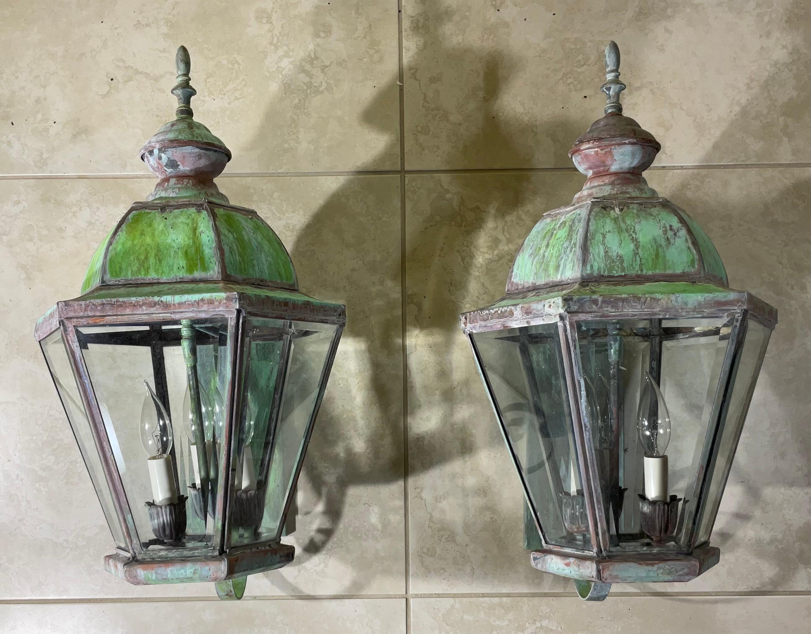 Beautiful pair of vintage wall lanterns hand crafted  from solid brass with three 40 watt  lights each .
Nicly oxidised patina , bell the glass electrified, and ready to use.
Will look great indoor or outdoor.
Backplate size : 11” x 4”.5