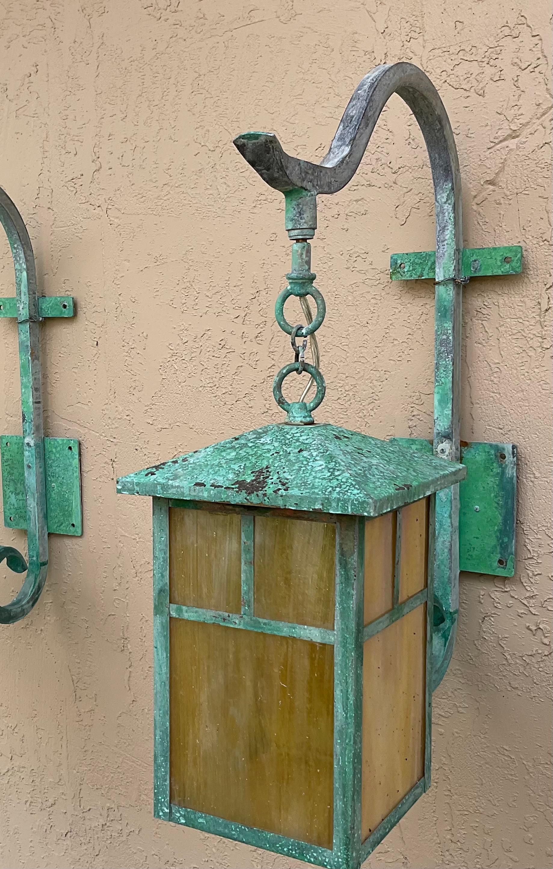 Beautiful pair of wall lantern made of solid brass, exceptional quality workmanship,  four side of art glass , electrified with one 60/watt light each, great patina .
Suitable for wet location, will look great indoors too
Backplate size : 5”x 5” 
