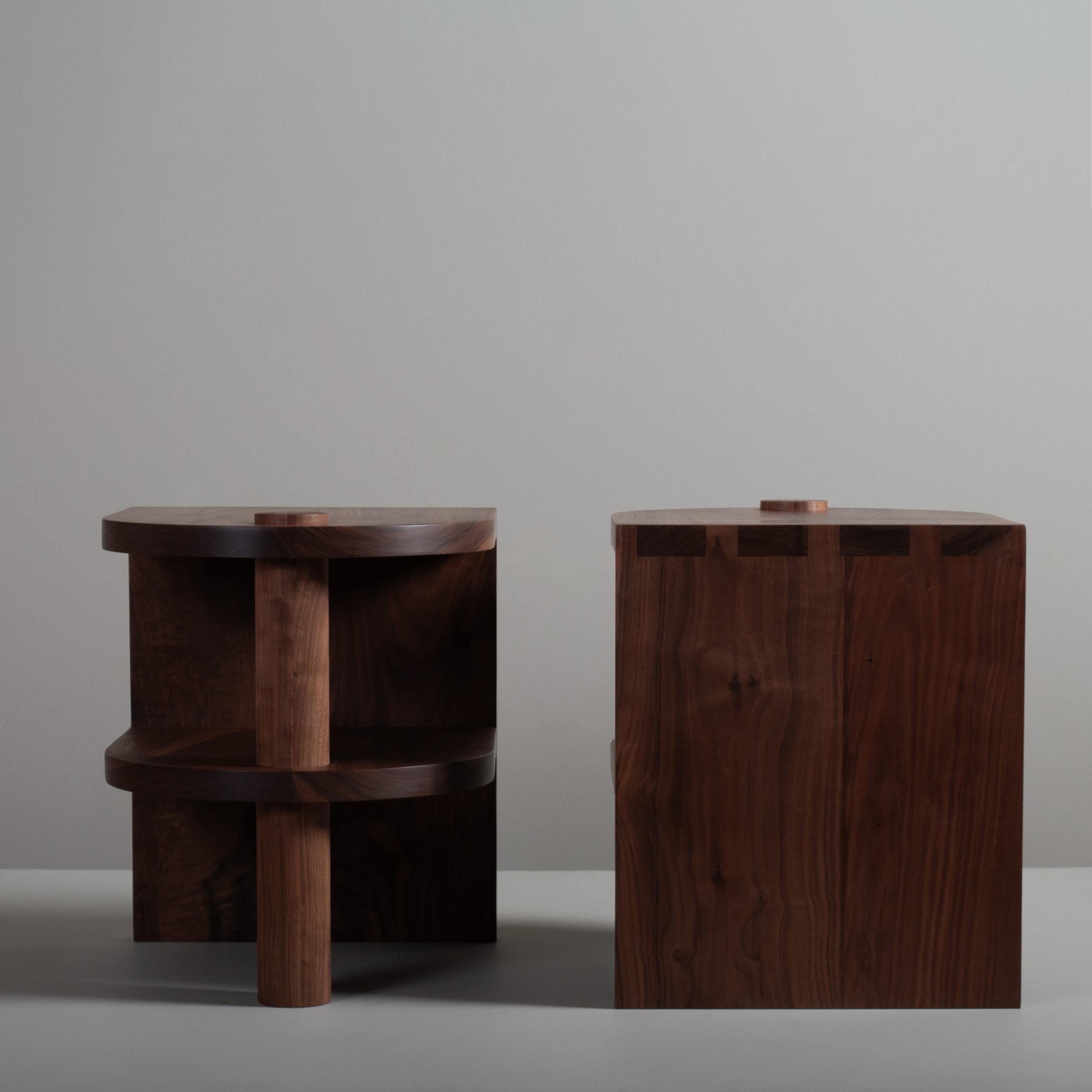 Pair of architectural postmodern/Art Deco American black walnut pillar end or side table. Design by Sum furniture and handcrafted in England using traditional techniques using the finest American black walnut. Hand-cut large dovetail jointing with