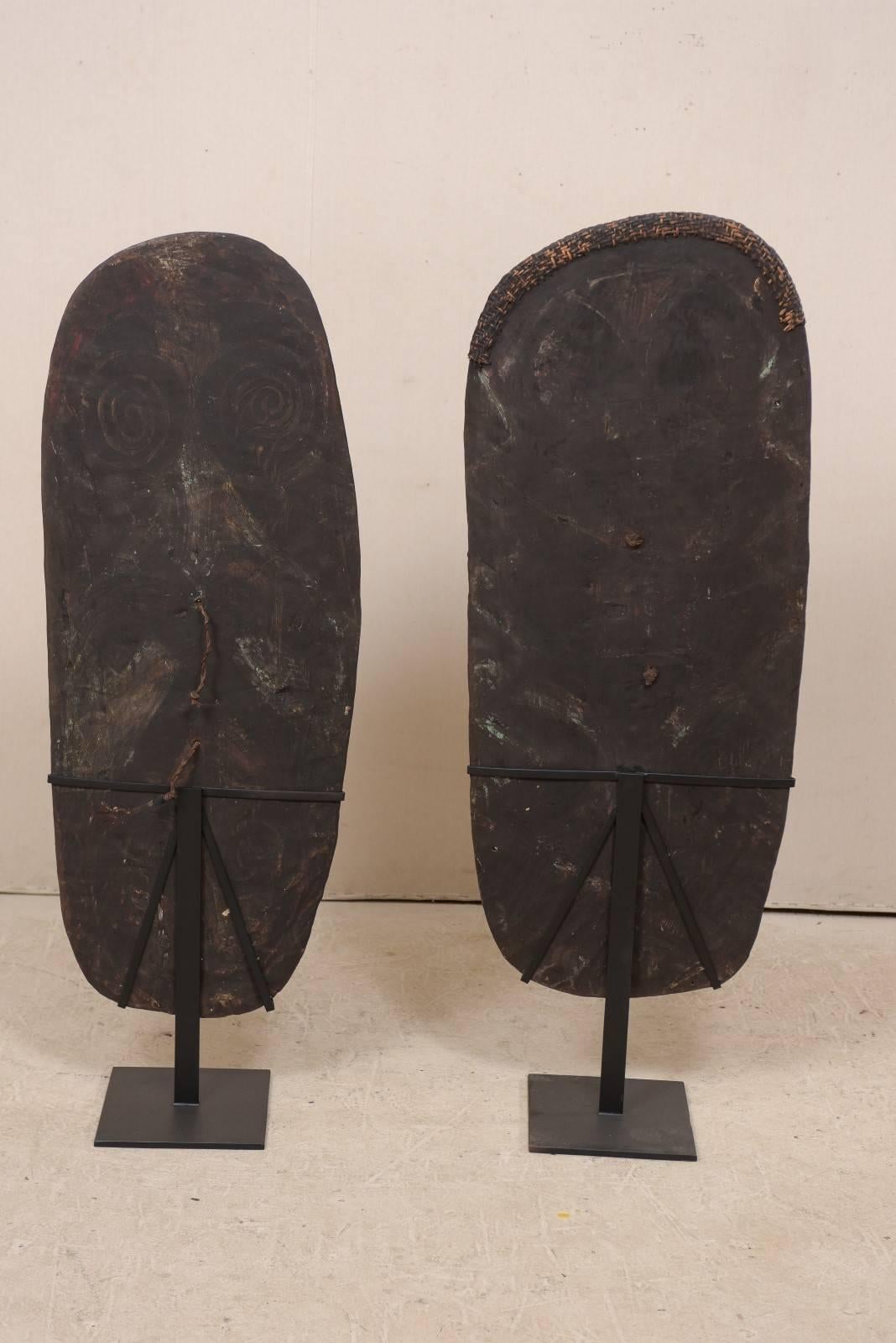Pair of Mendi Carved-Wood War Shields from Papua New Guinea on Custom Stands In Good Condition For Sale In Atlanta, GA