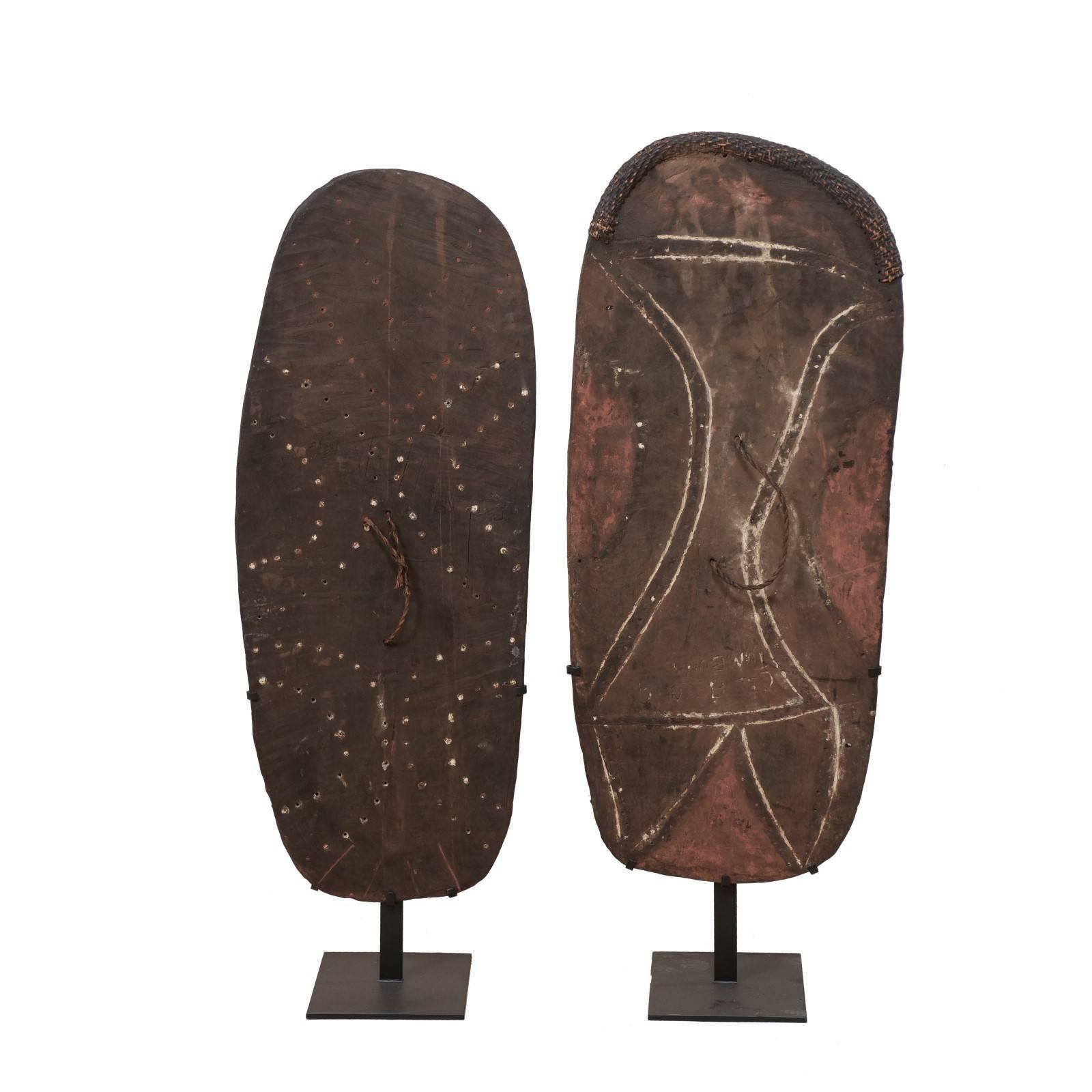 Pair of Mendi Carved-Wood War Shields from Papua New Guinea on Custom Stands