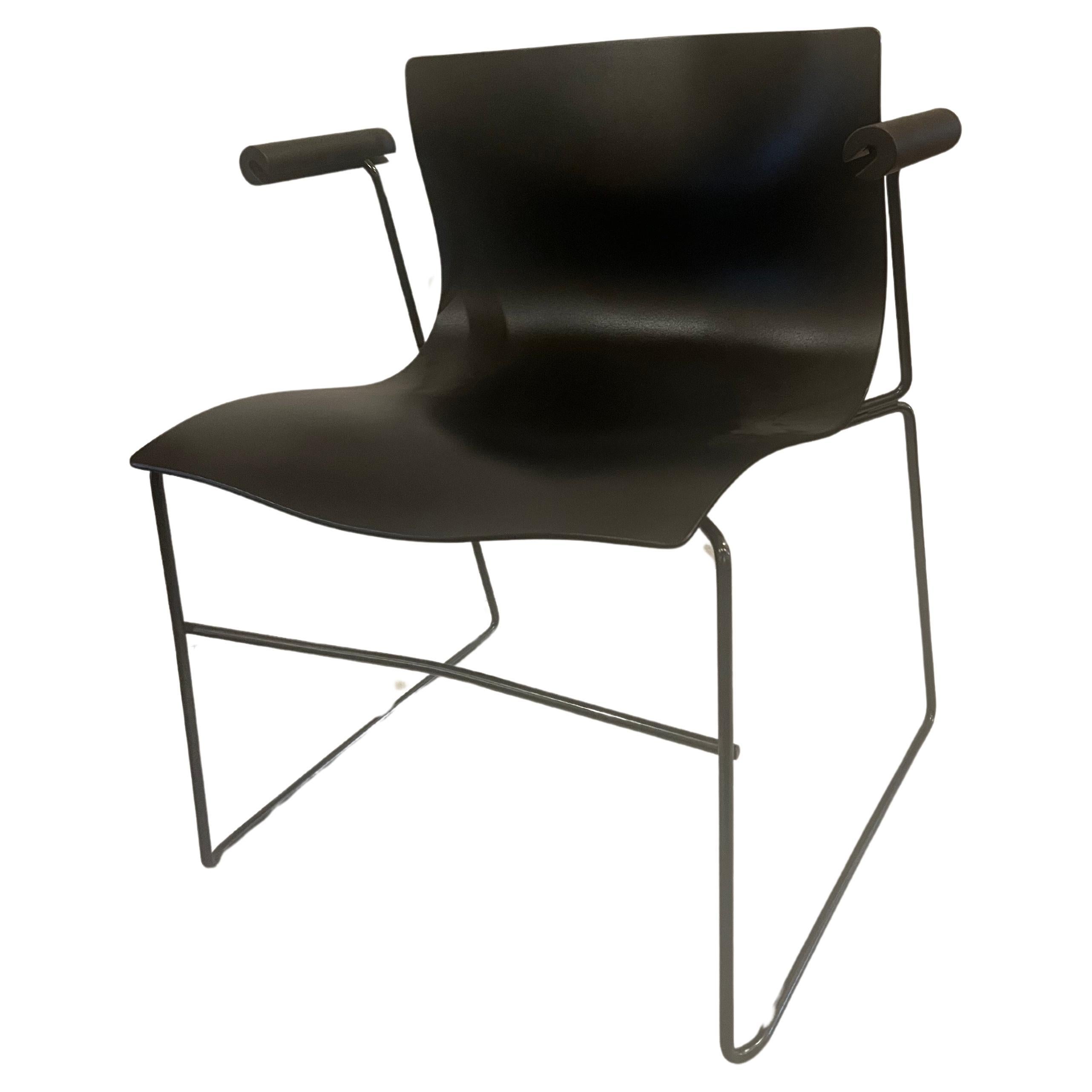 A great pair of armchairs designed by Massimo Vignelli for Knoll, circa 1983, for Knoll studio in great condition, black on black the seats are very clean these chairs are nice and comfy. These chairs are stackable for storing or moving. Stamped and
