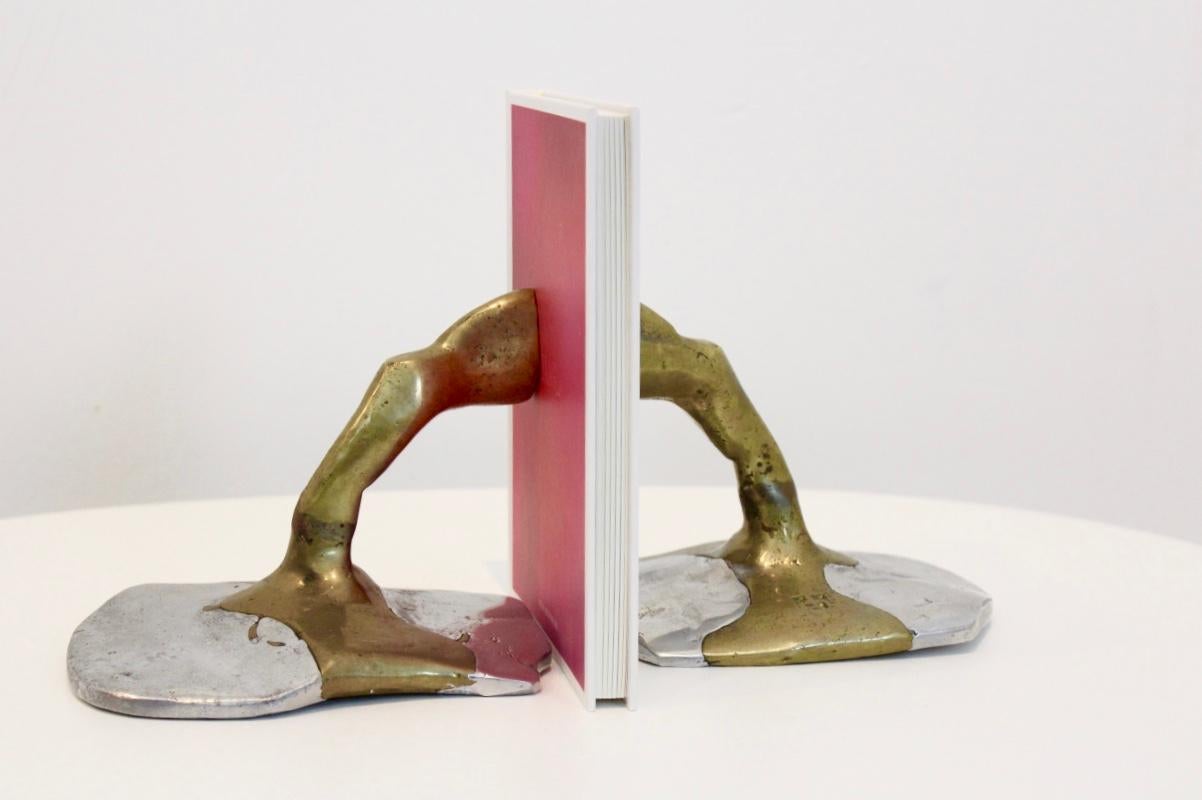 Rare pair of David Marshall Brutalist bookends. Consisting of a beautiful combination of sculptured aluminium and cast brass which brings a very smooth-raw Brutalist performance. David Marshall born in Scotland and moved to Spain, designed and