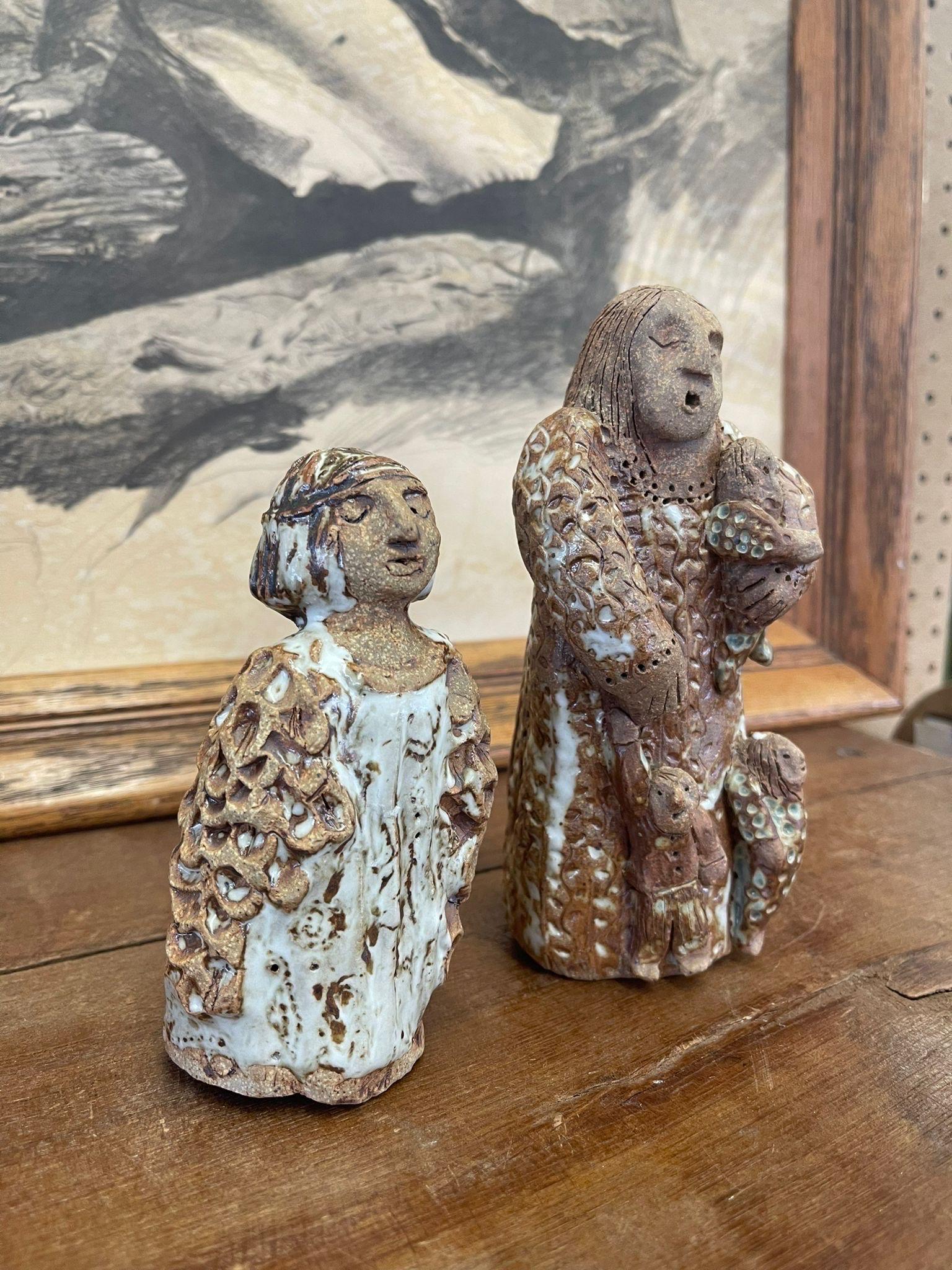 This set of Ceramic figurines have white glazing and intricate floral design. Makers mark on the bottom by Gretchen Bear in 2012. Vintage Condition Consistent with Age as Pictured.

Dimensions. Larger. 3 W ; 3 D ; 6 1/2 H
                   Smaller.