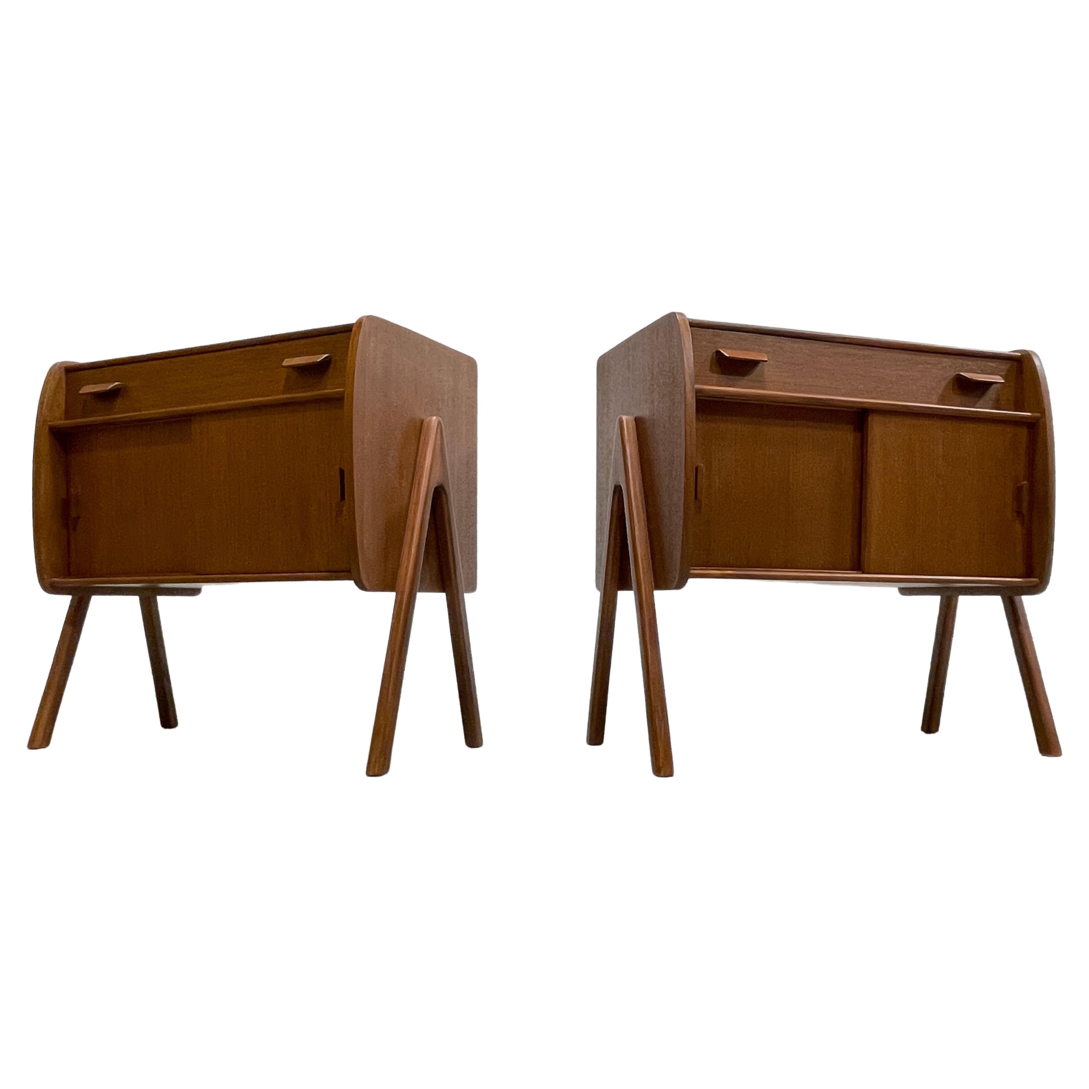 Pair of Handmade Mid-Century Modern styled Teak Cabinets / Entryway Cabinets. Perfect bedside cabinets or storage cabinets anywhere in your home. Fantastic design details such as floating legs, sliding doors and drawer storage and finished back.