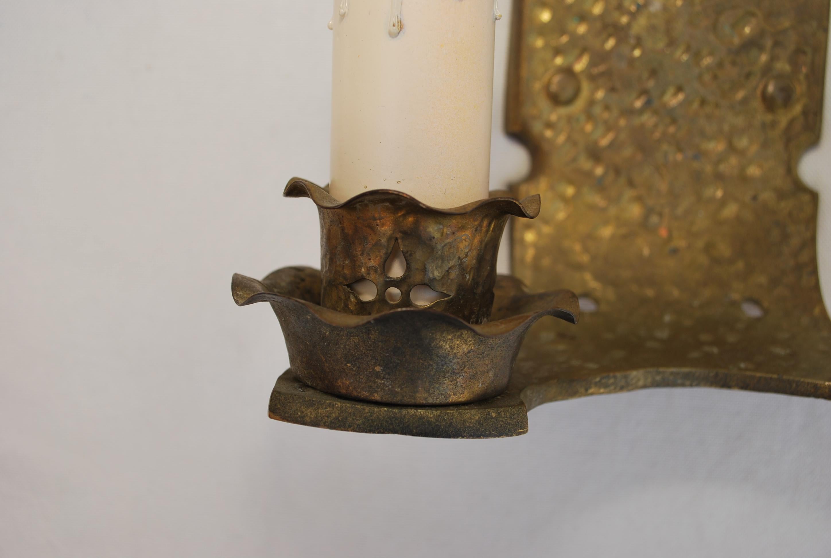 Arts and Crafts Pair of hands  hammered  turn of the century solid brass sconces For Sale