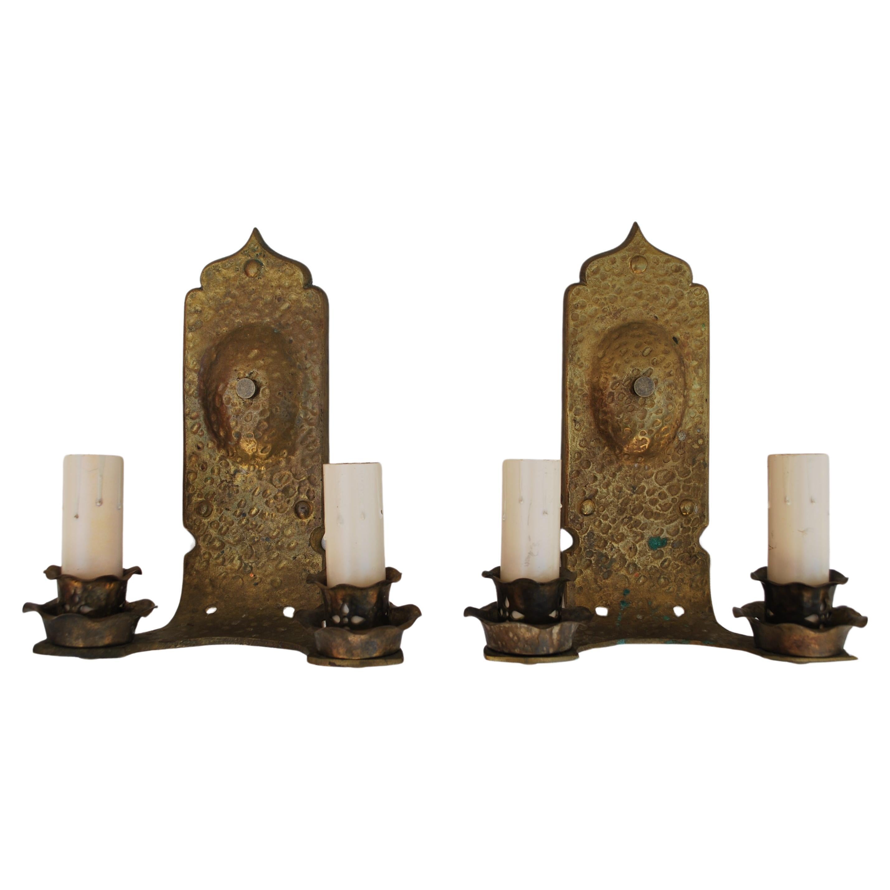 Pair of hands  hammered  turn of the century solid brass sconces For Sale