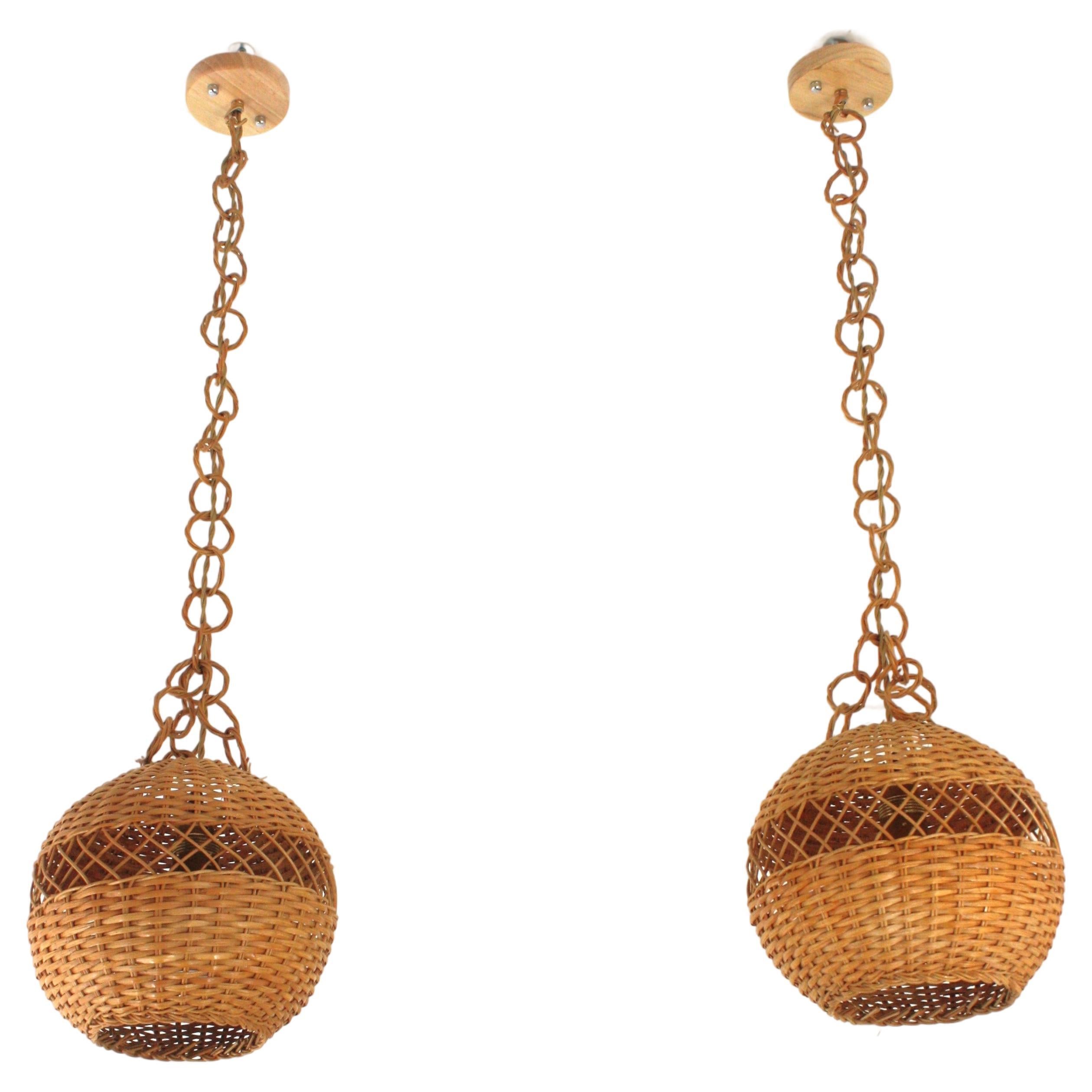 Mid-Century Modern Pair of Handwoven Wicker Globe Pendant Lights or Lanterns For Sale