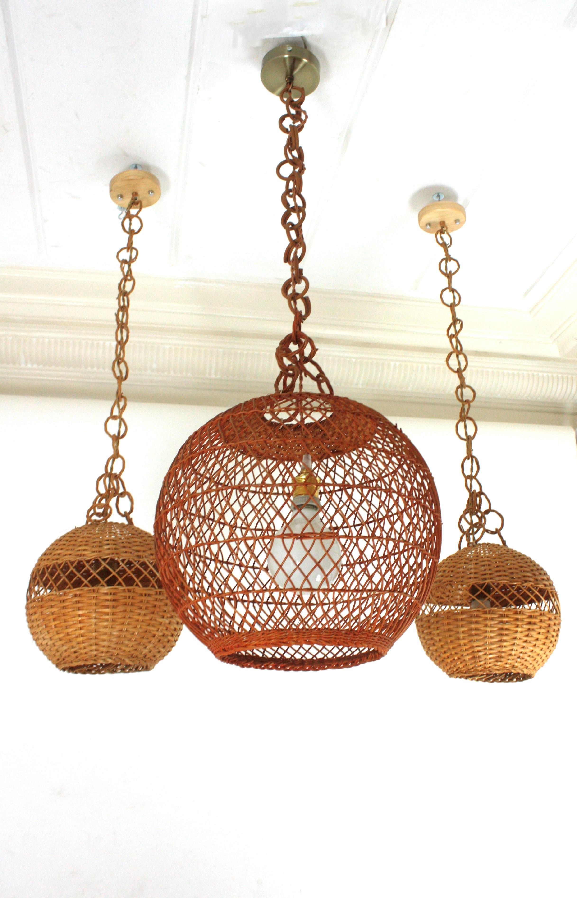 Hand-Crafted Pair of Handwoven Wicker Globe Pendant Lights or Lanterns For Sale