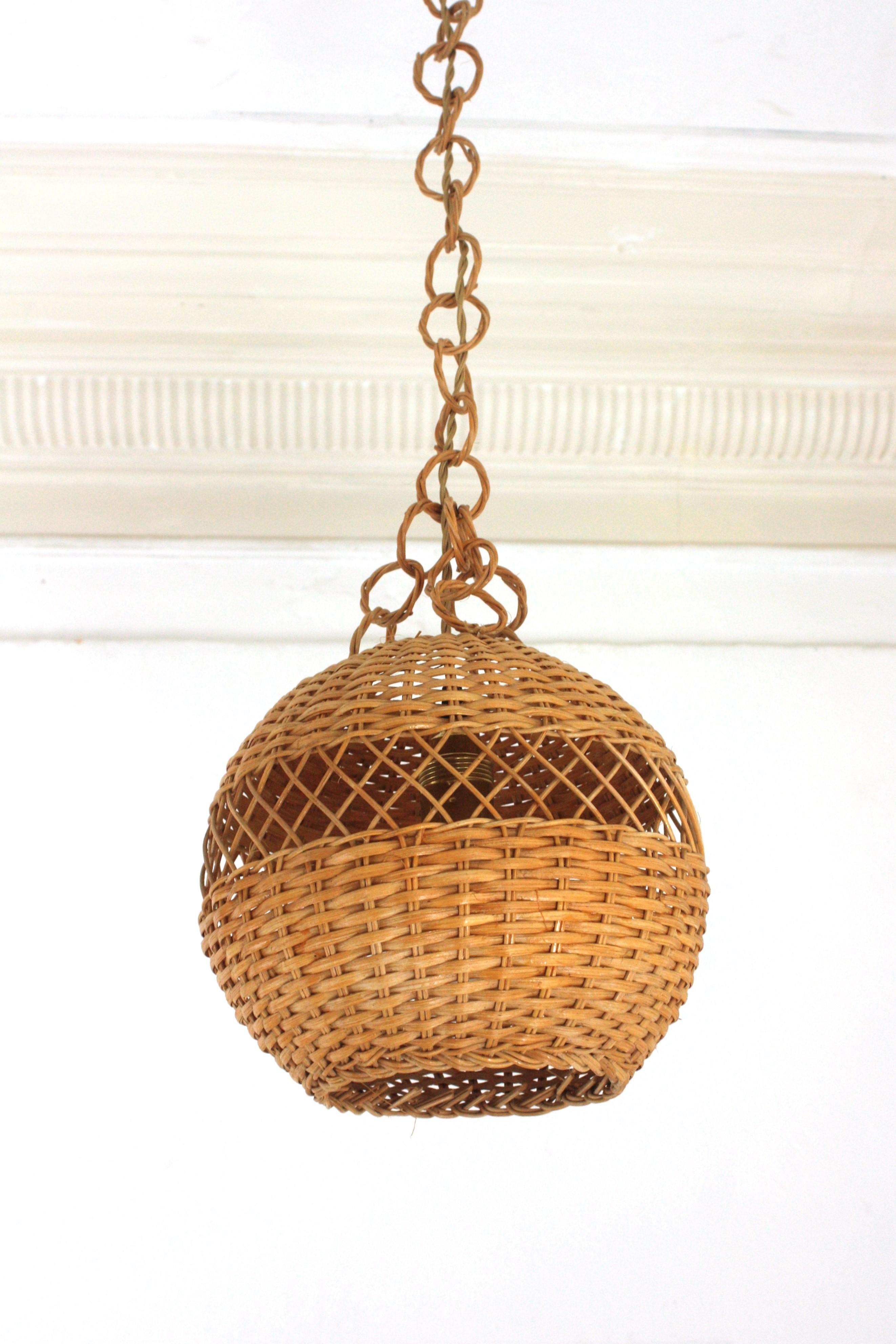 Pair of Handwoven Wicker Globe Pendant Lights or Lanterns For Sale 1