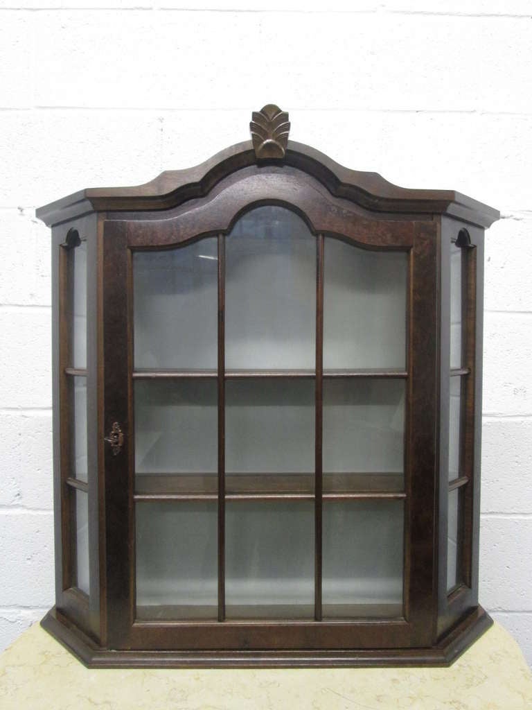 Lovely pair of hanging wall cabinets with glass doors and glass sides. The cabinets also have two shelves inside.