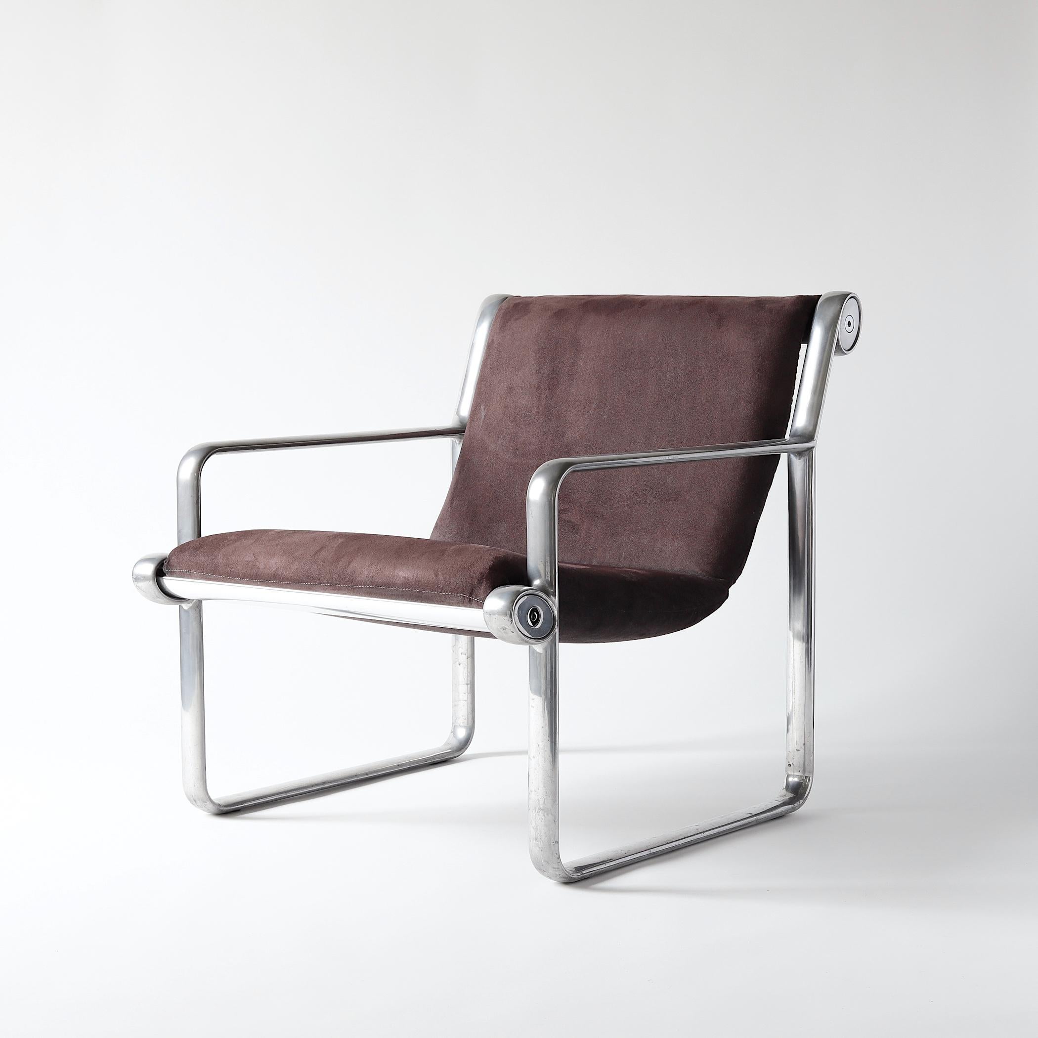 Pair of aluminum open armchairs with purple microsuede upholstery designed by Bruce Hannah and Andrew Morrison for Knoll in 1971. The design team worked together at Knoll throughout the 1970s and won numerous design awards. 

Like Marc Newson's
