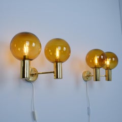 Pair of Hans-Agne Jakobsson Brass Wall Lamp Model. V 149/2, Amber Glass, 1950s